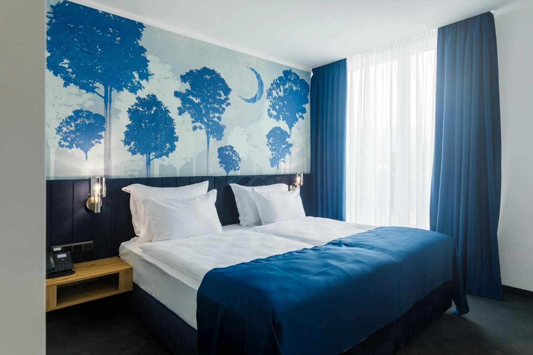 Bed in Blue Star Luxury Hotel