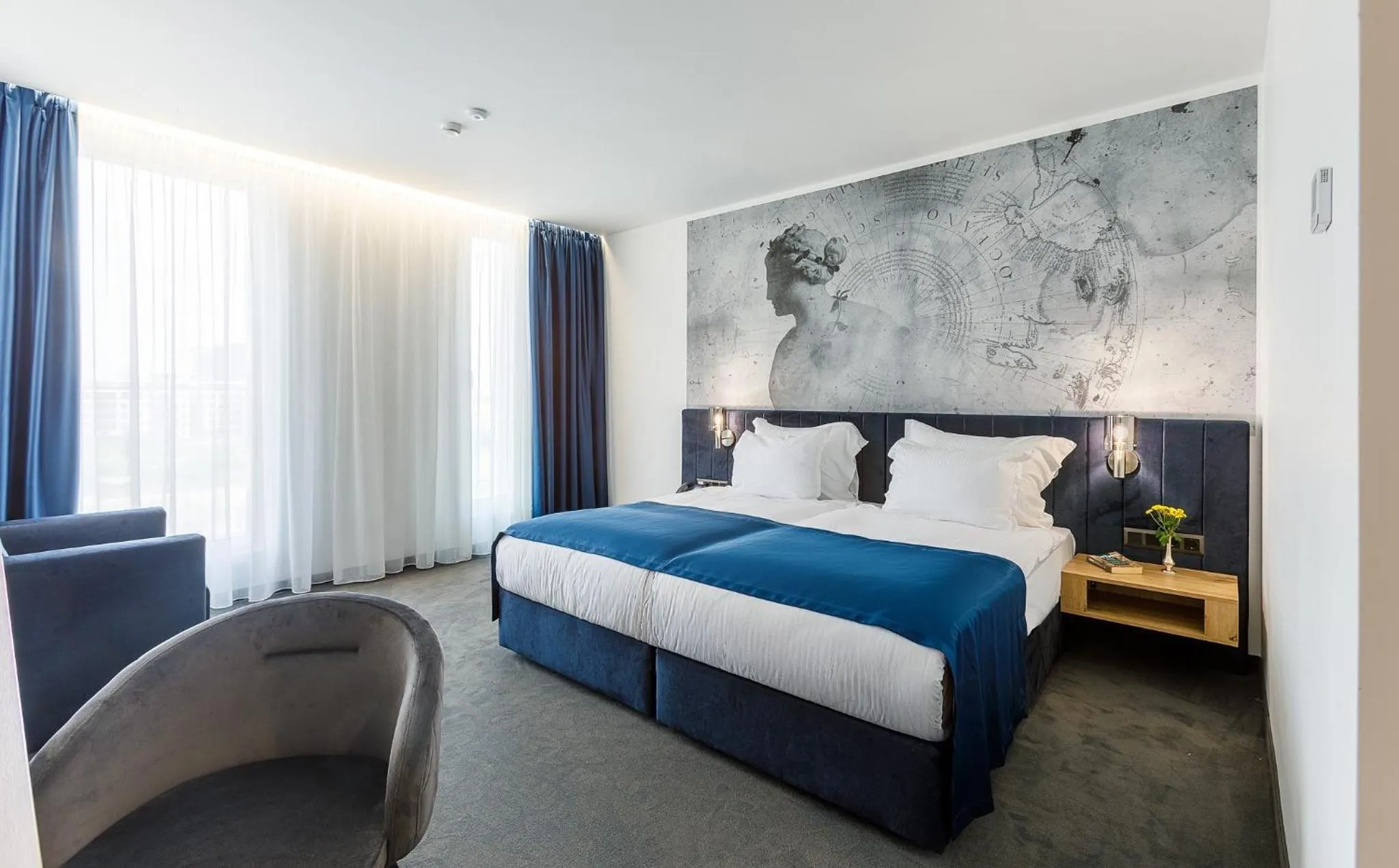 Bed in Blue Star Luxury Hotel