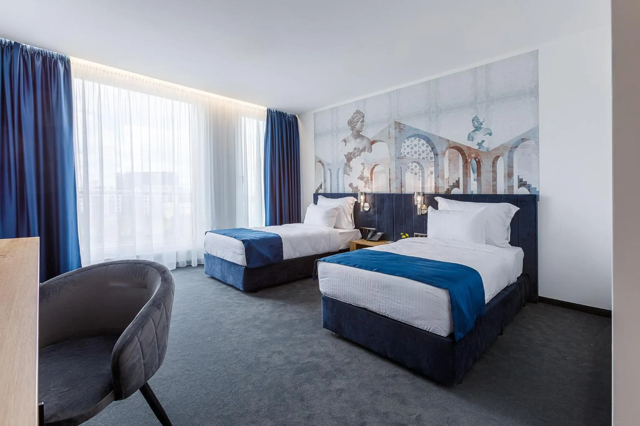 Bed in Blue Star Luxury Hotel