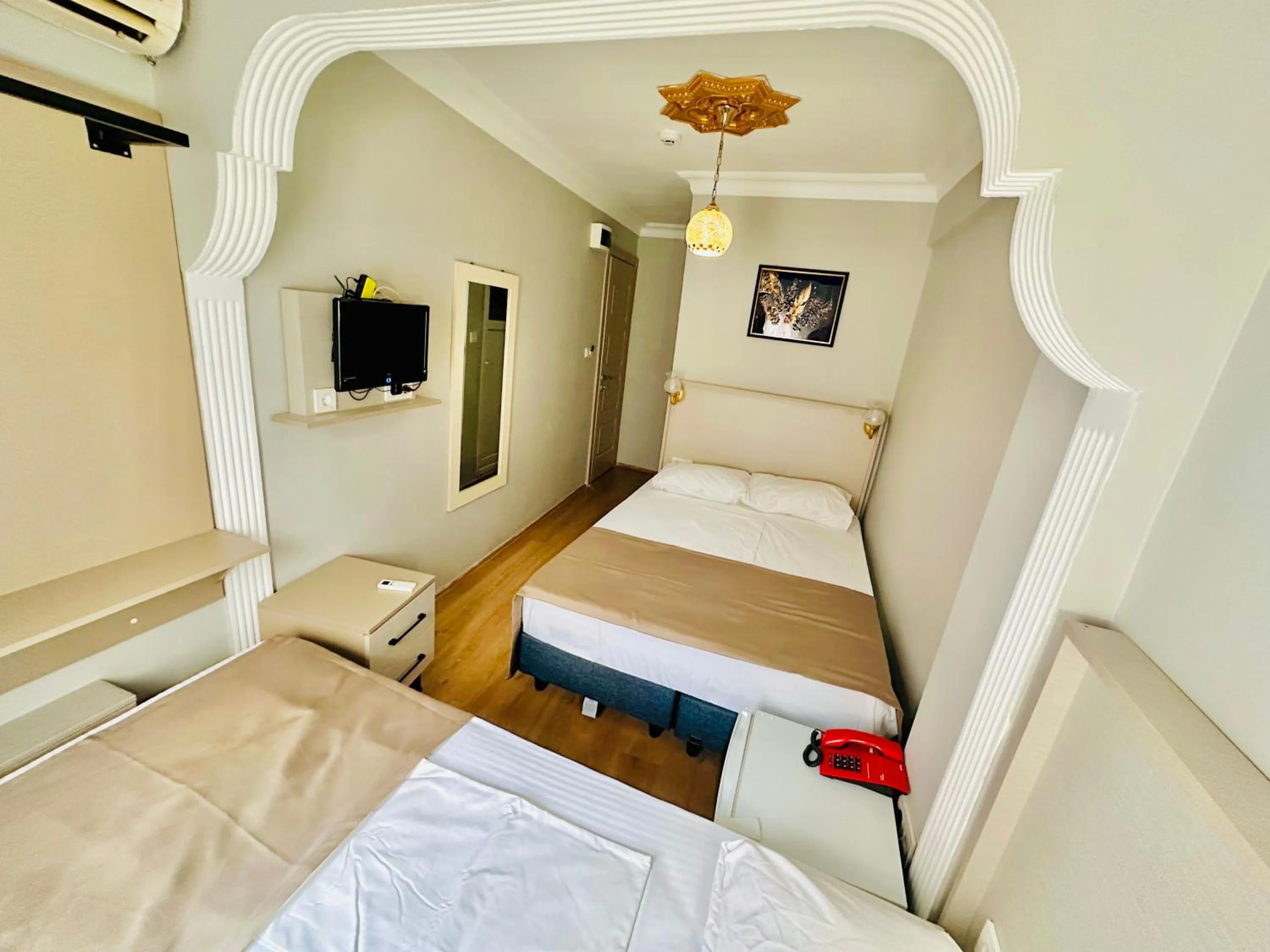 Seating area, Bed in Crowned Exclusive Hotel