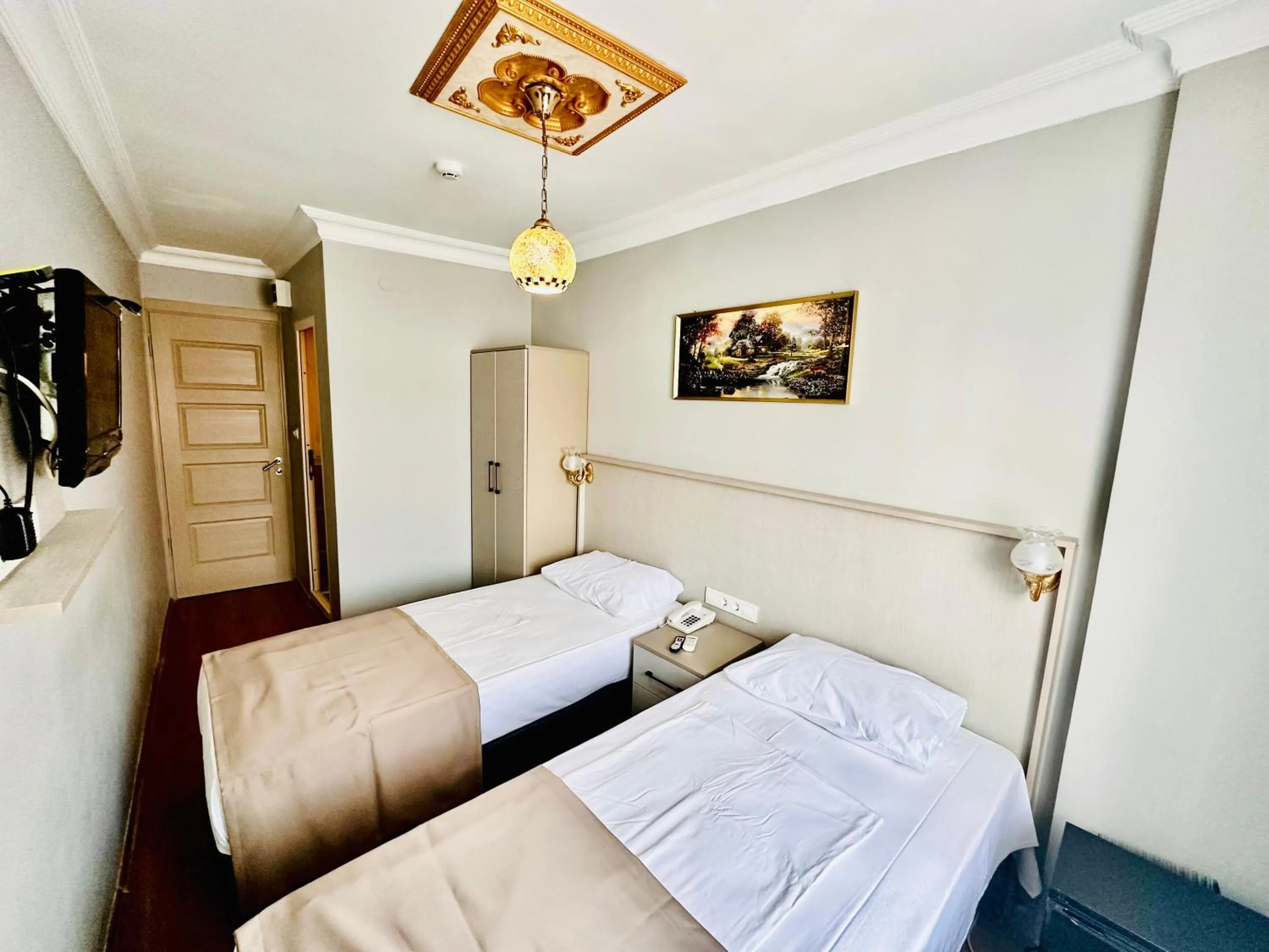 Bed in Crowned Exclusive Hotel