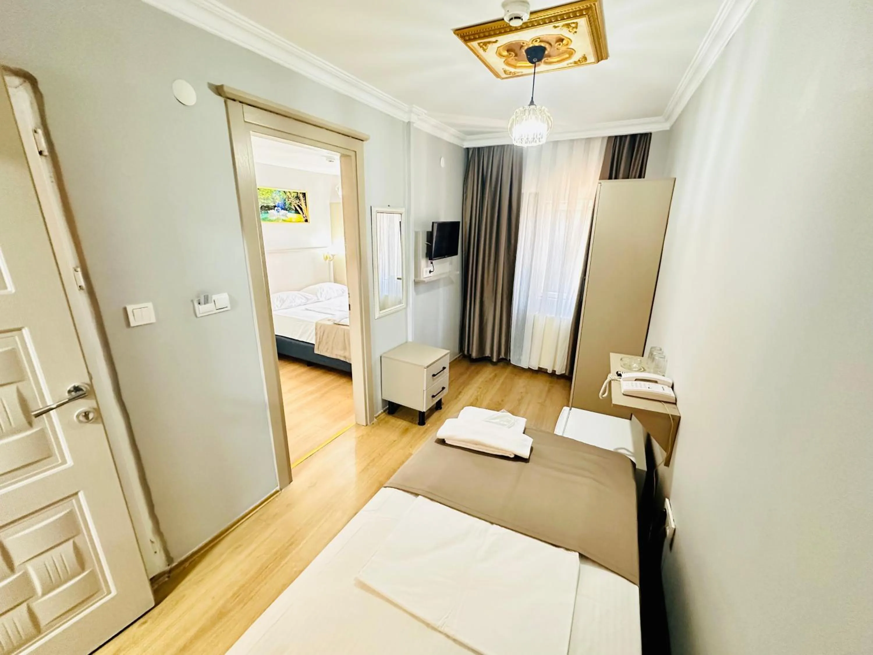 Photo of the whole room, Bed in Crowned Exclusive Hotel