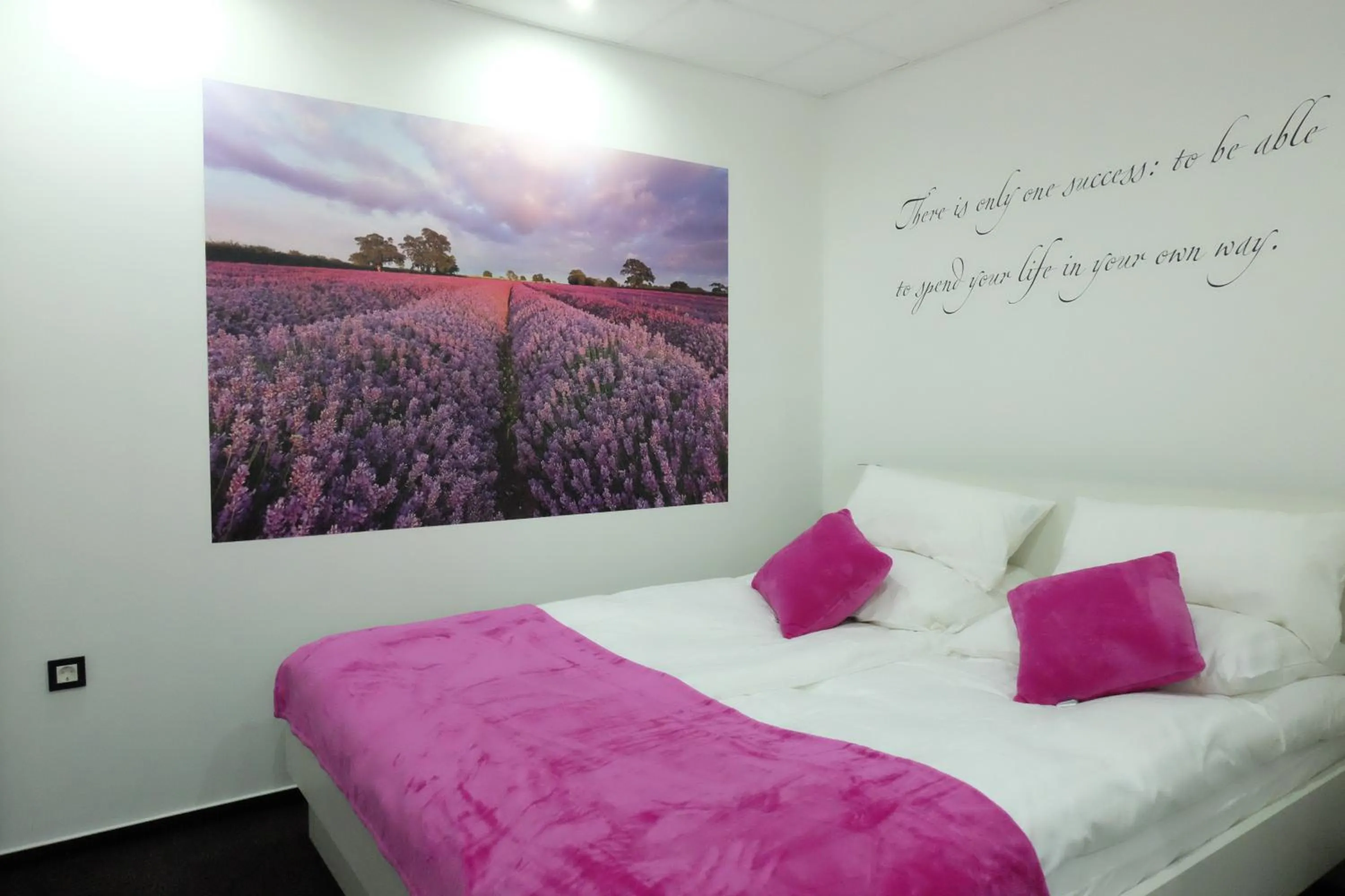 Bed in Luwiana Suites