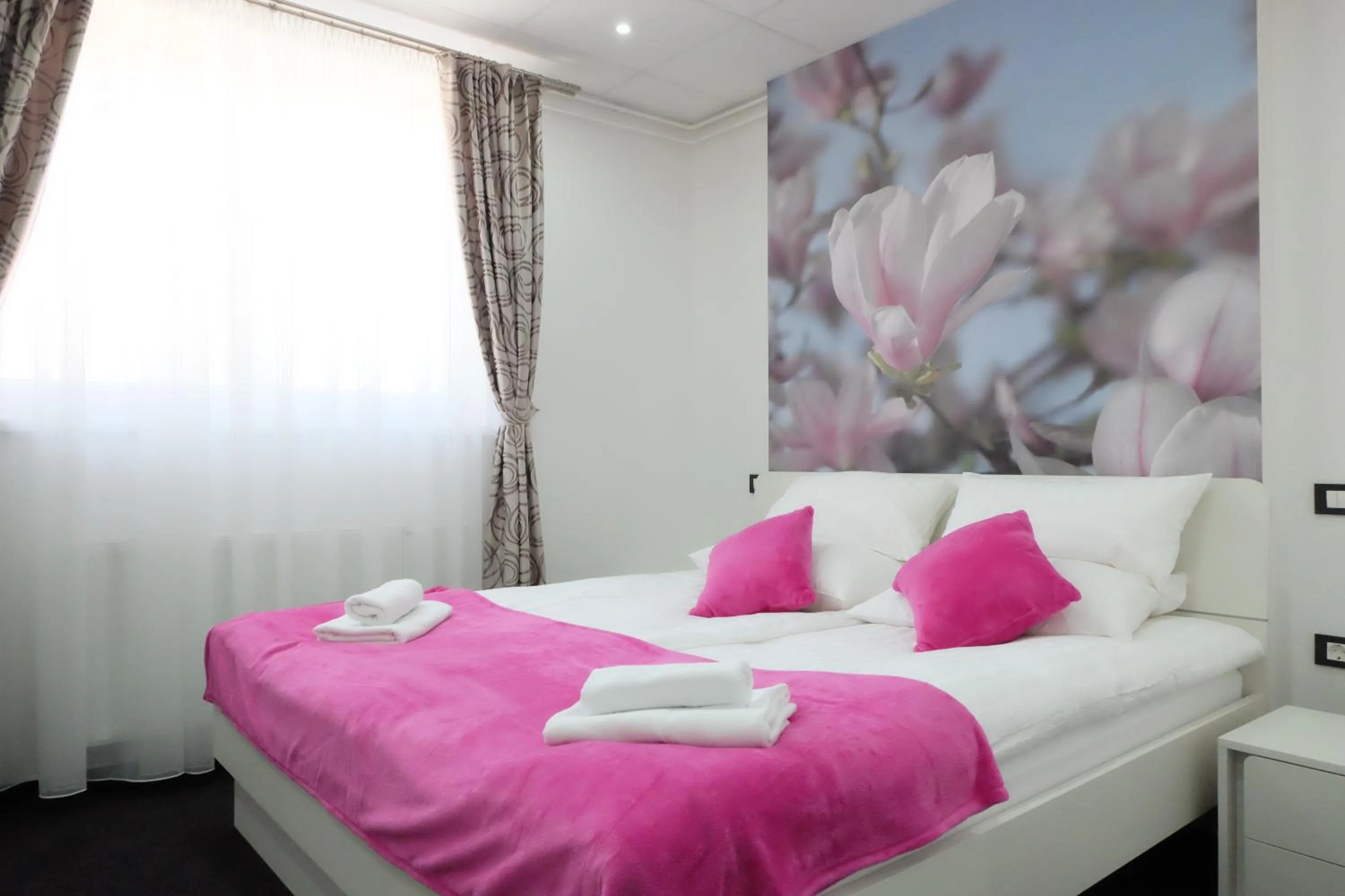 Bed in Luwiana Suites