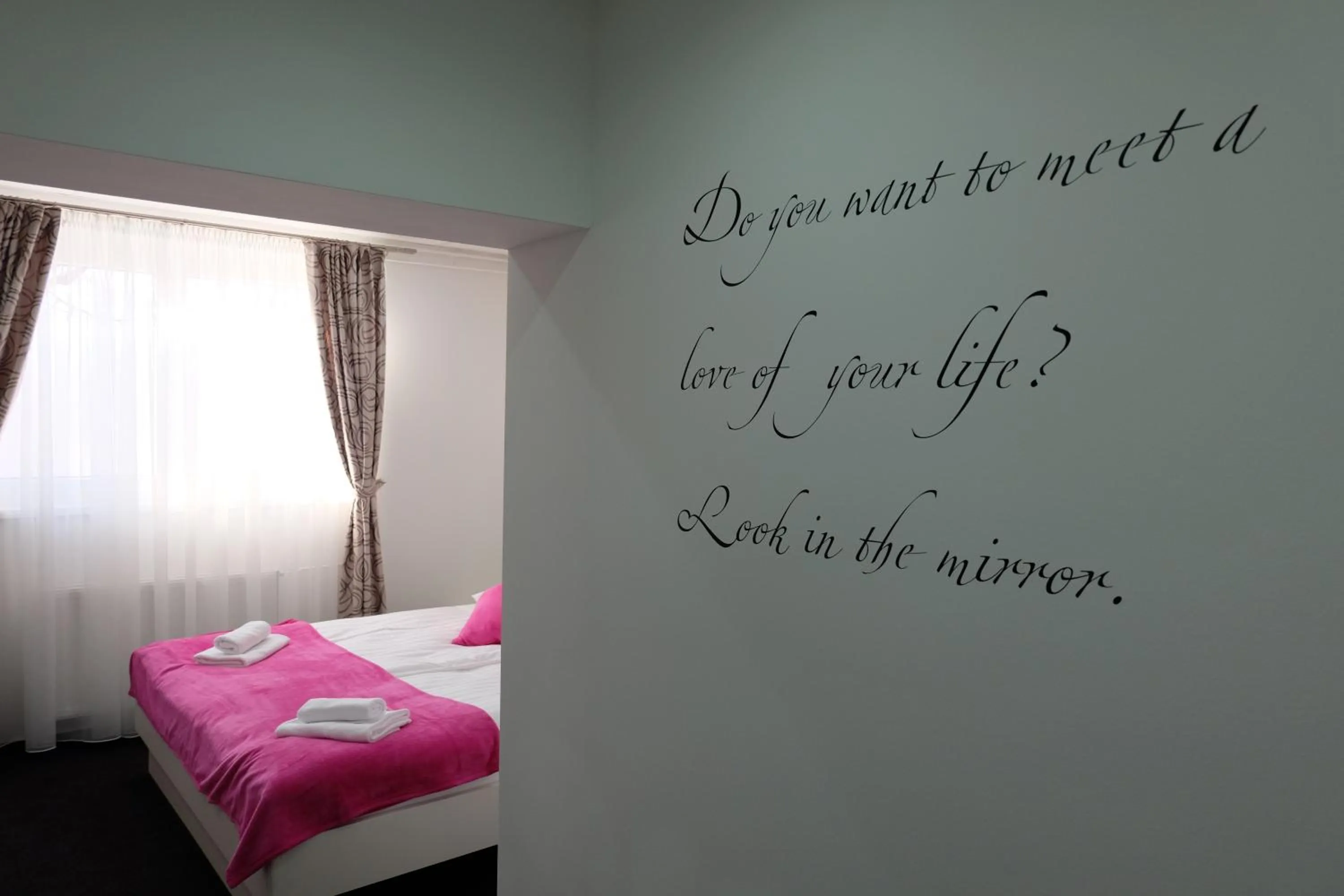 Bed in Luwiana Suites