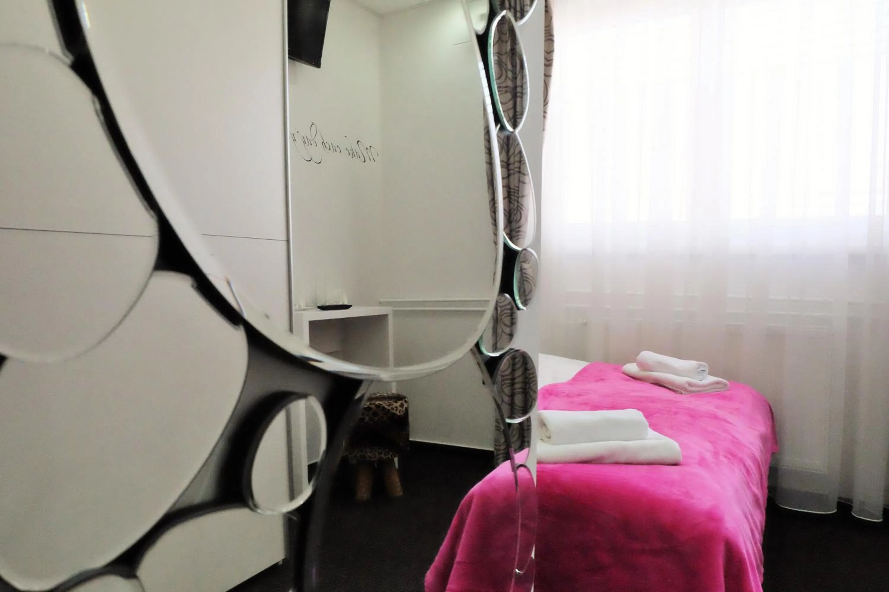 Bed in Luwiana Suites