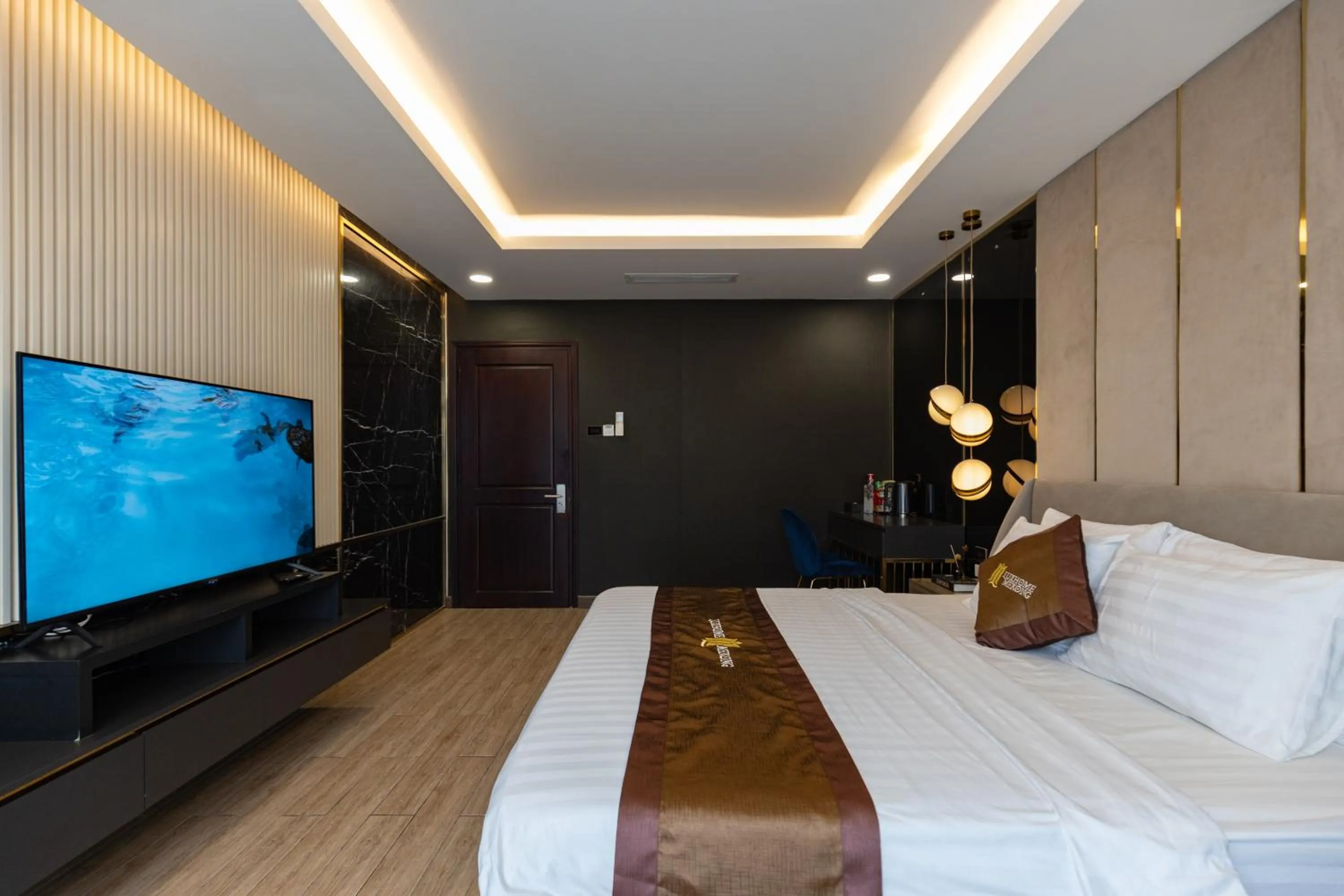 Bed in Luxhome Mekong Hotel