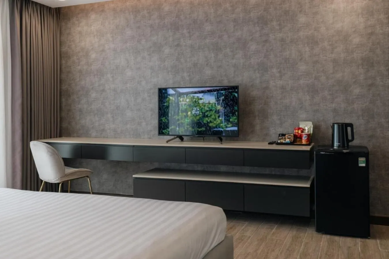 Bed in Luxhome Mekong Hotel