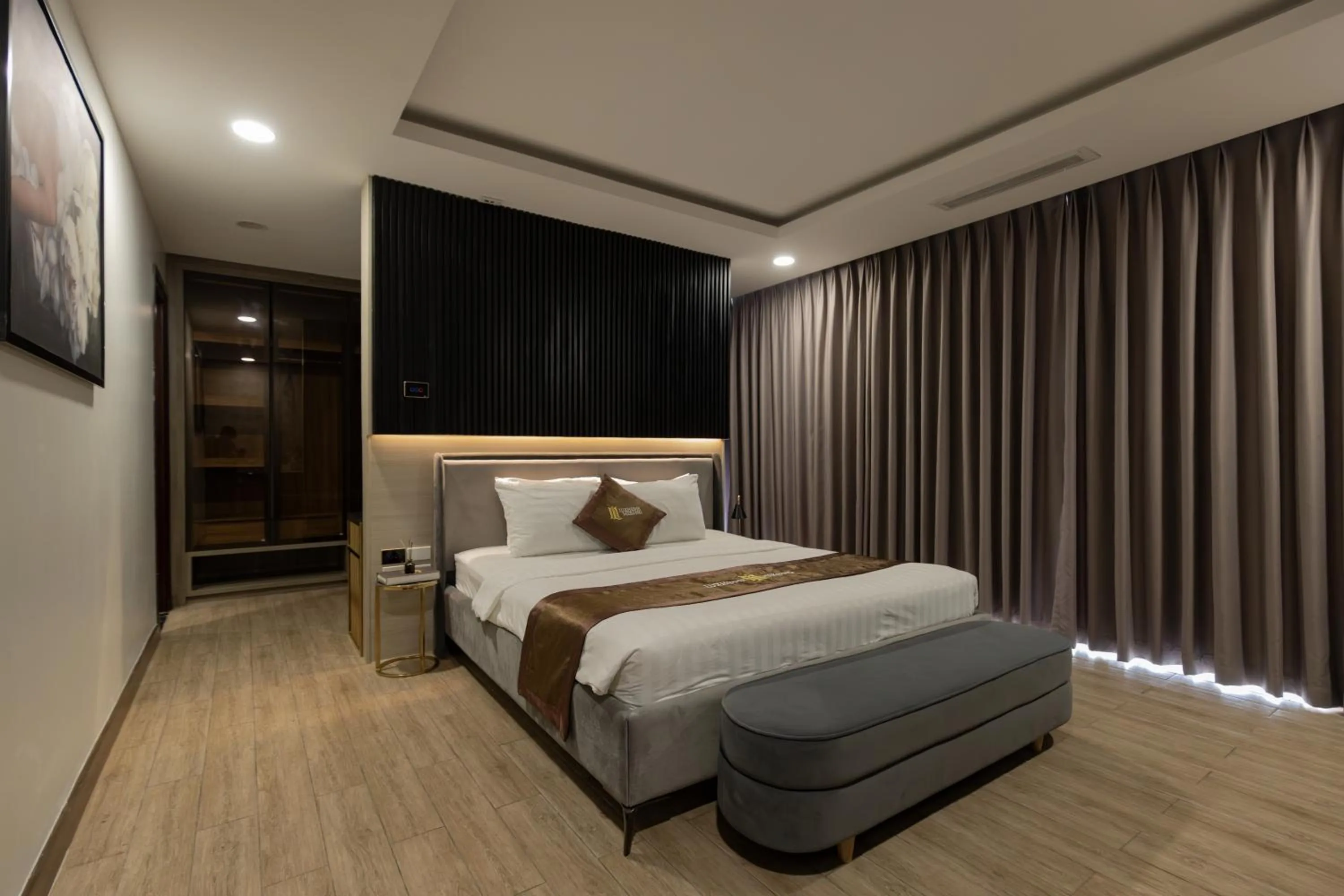 Bed in Luxhome Mekong Hotel