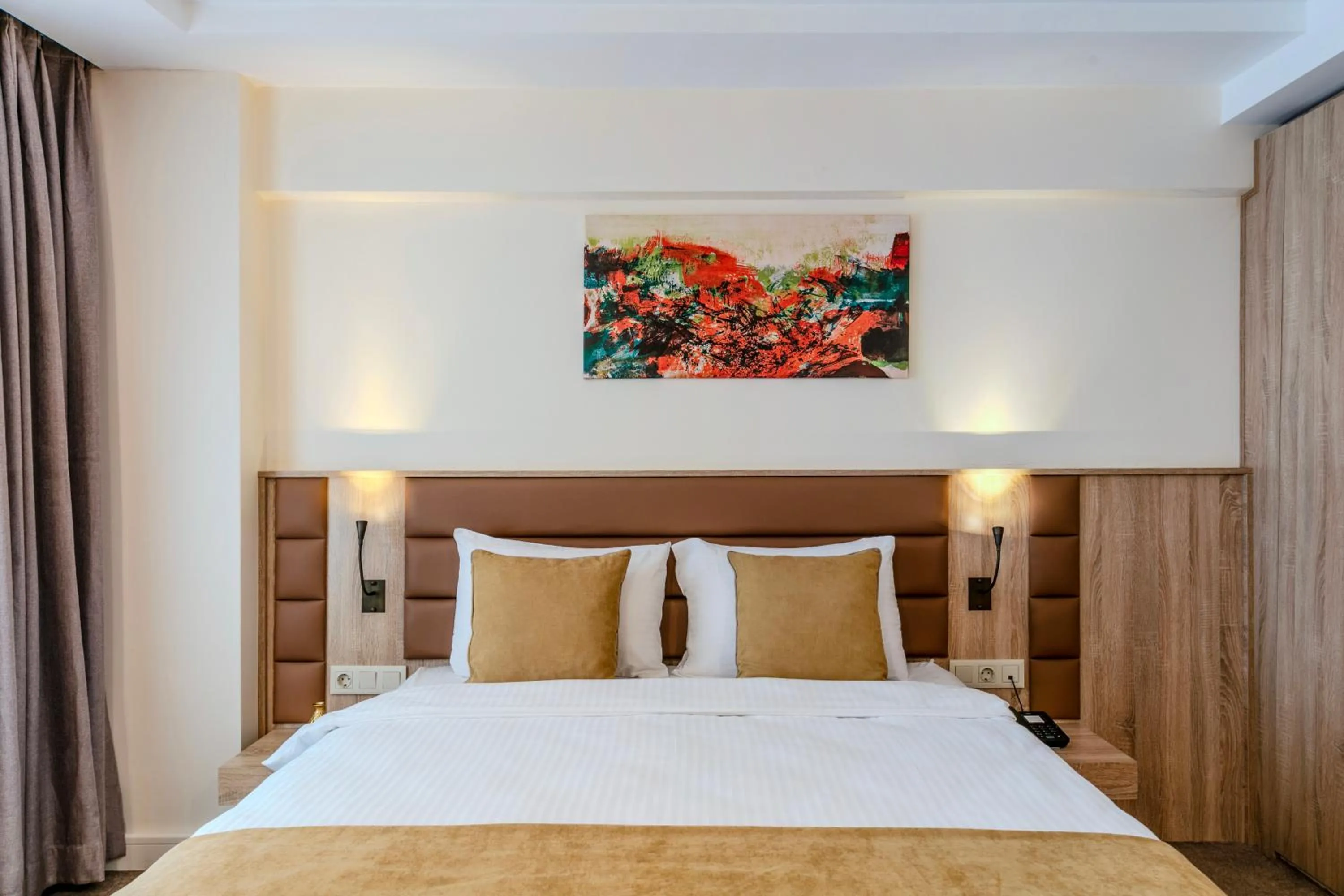 Bed in Roys Hotel & Suites