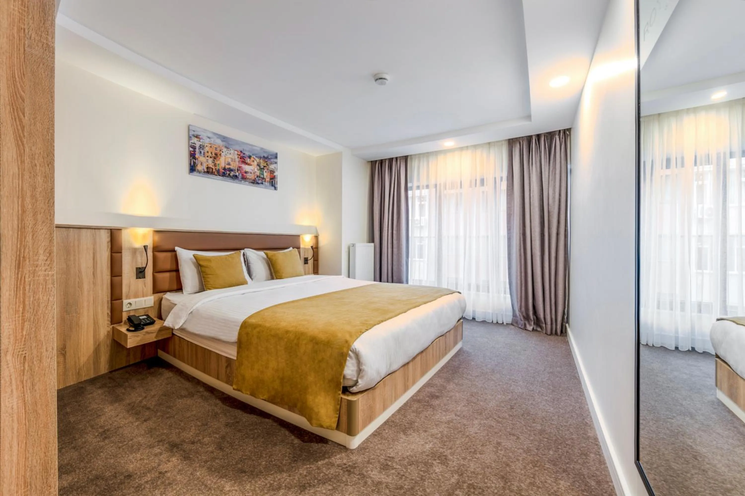 Bed in Roys Hotel & Suites