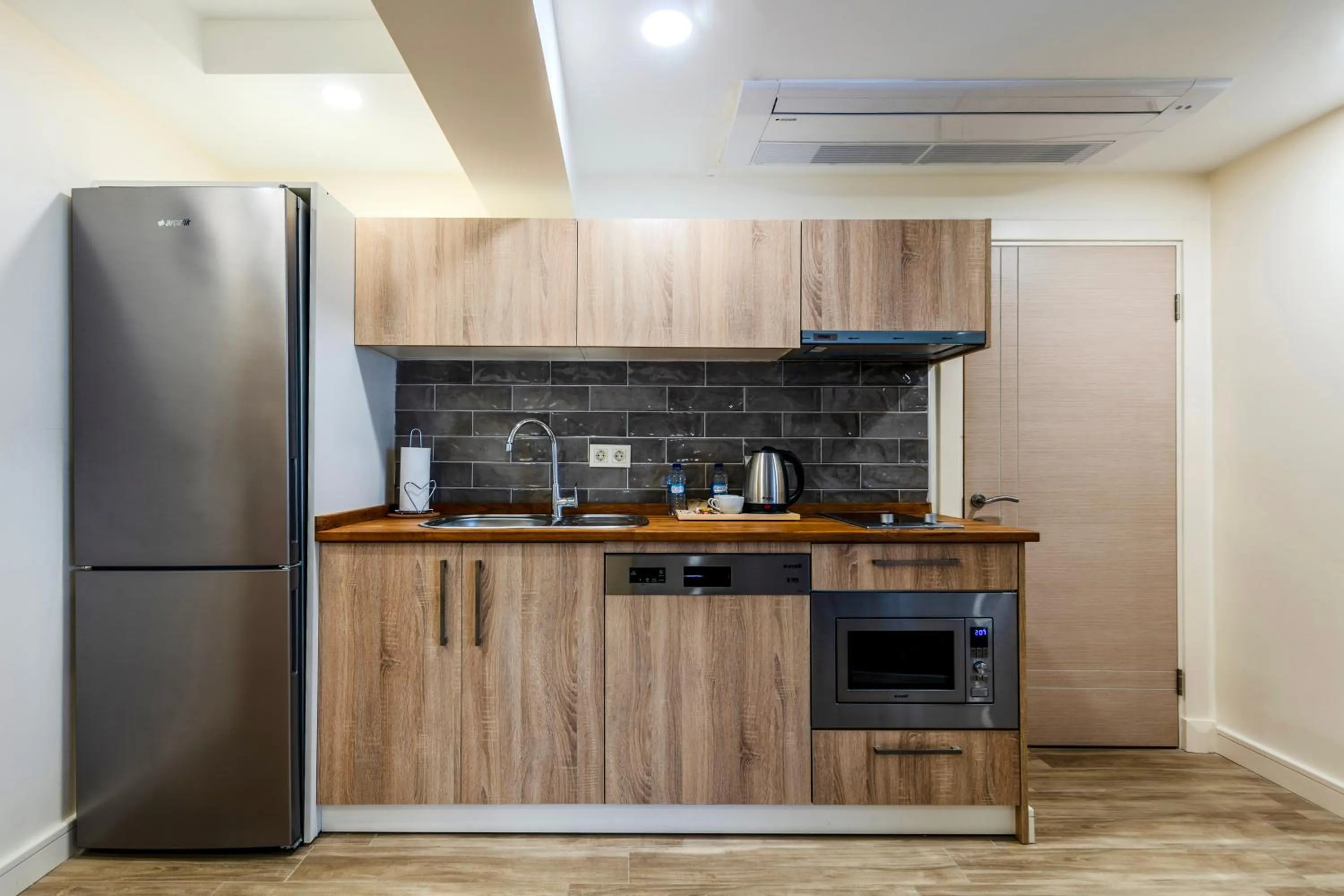 Kitchen or kitchenette in Roys Hotel & Suites