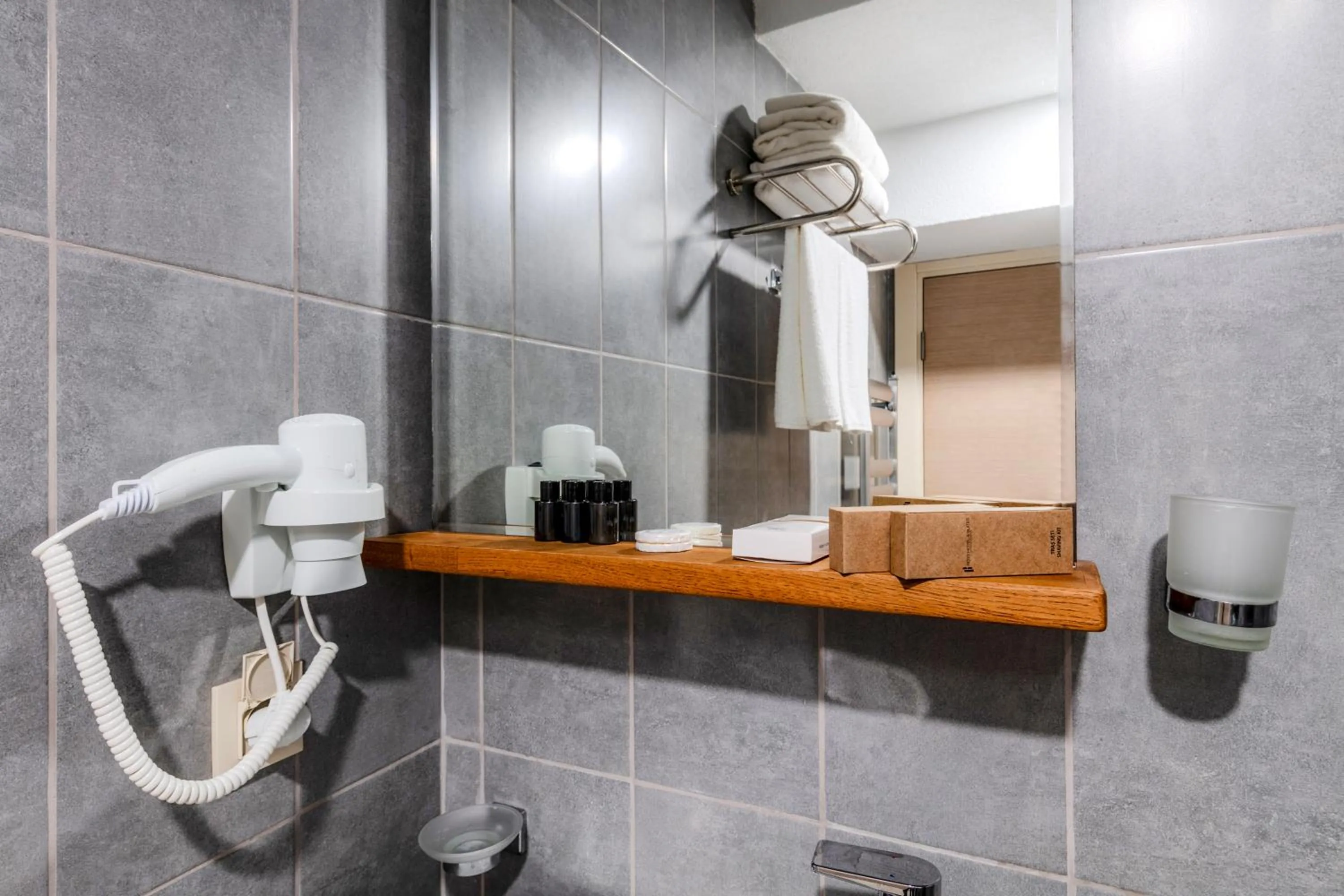 Bathroom in Roys Hotel & Suites