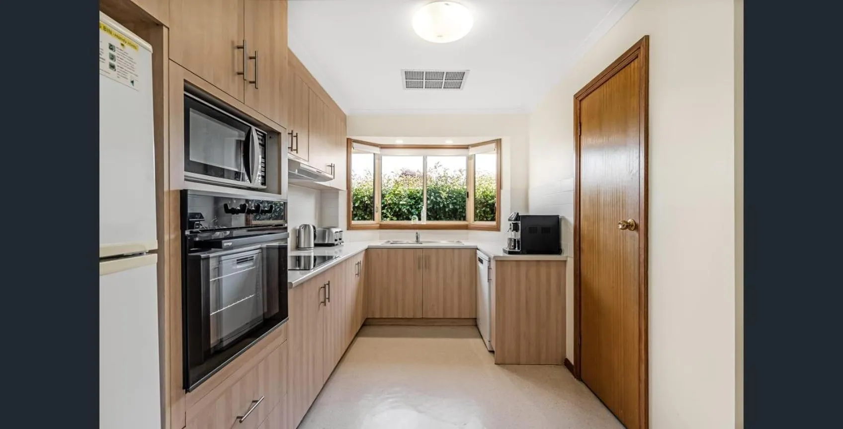 Kitchen or kitchenette in Apartments on Tolmie