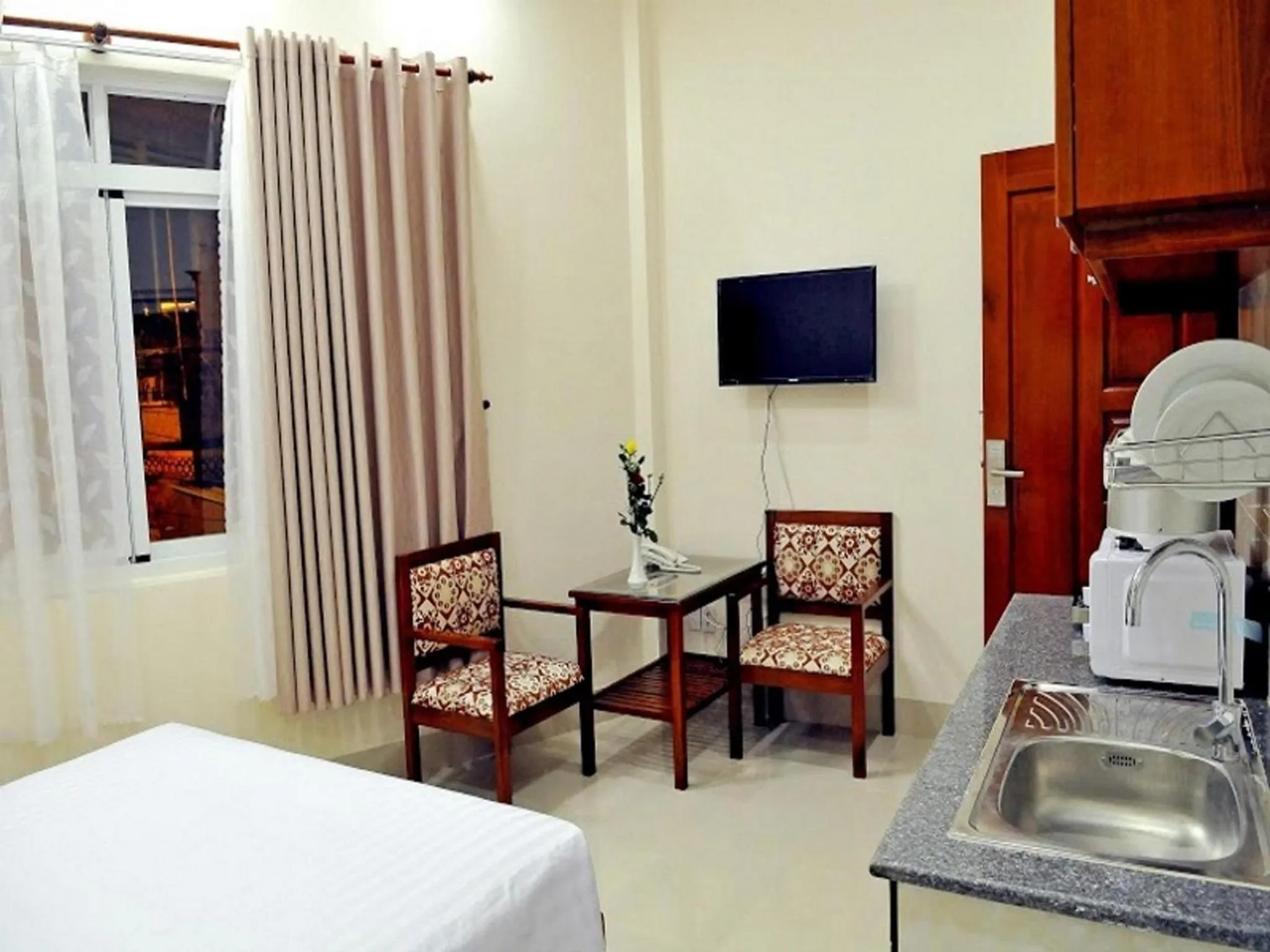 Bed in Lotus Apartment Hotel