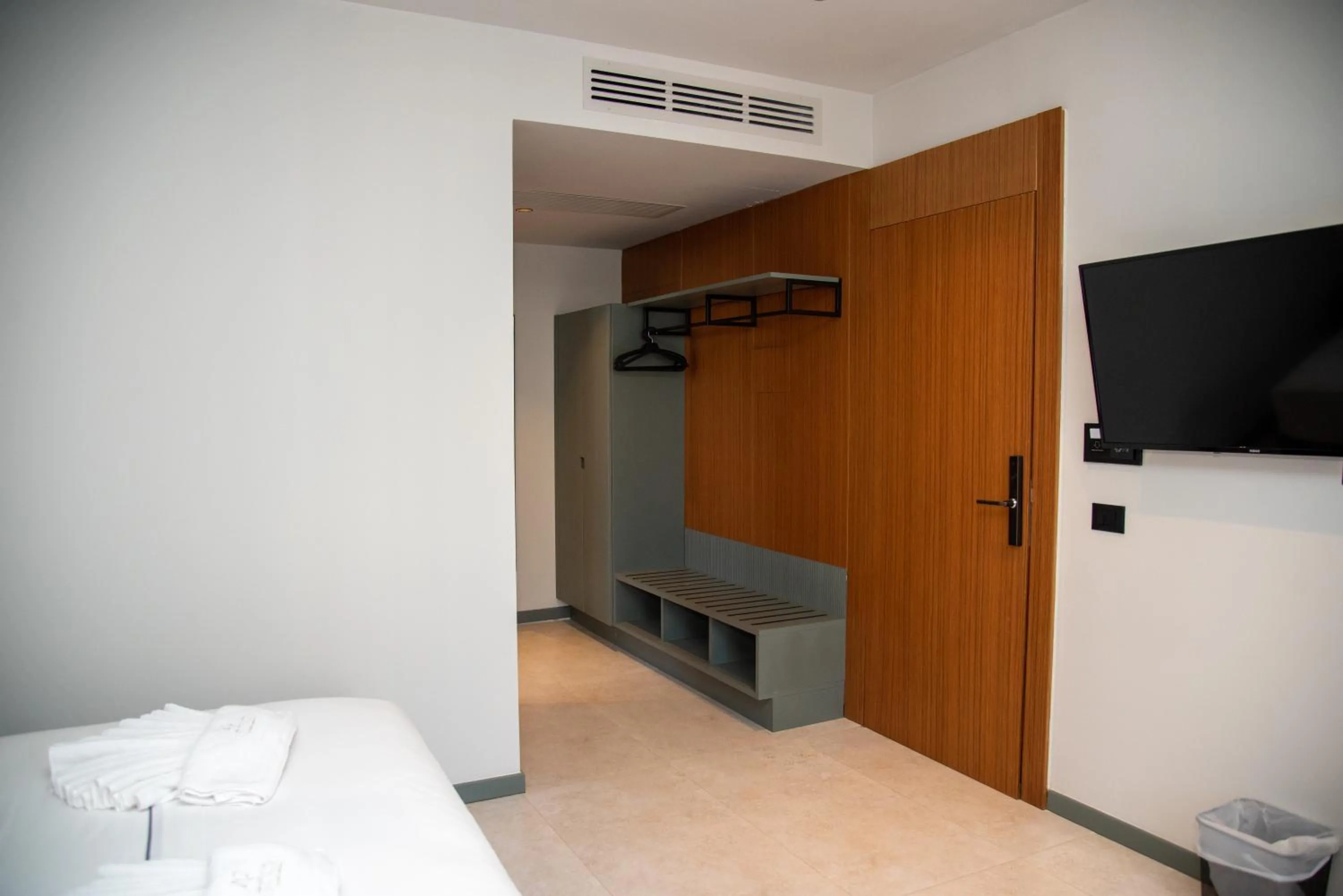 Communal lounge/ TV room, Bed in Adria Palace