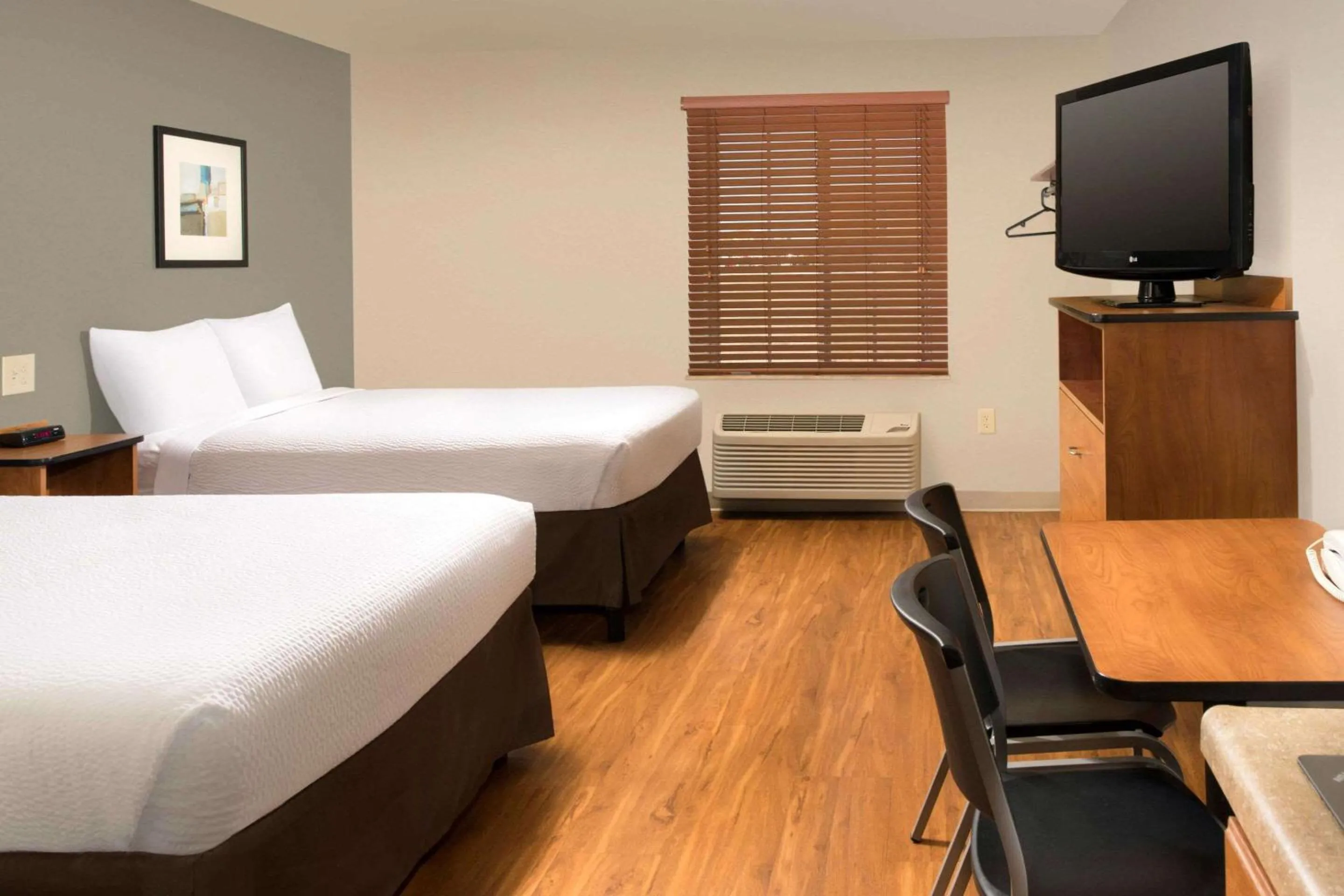 Photo of the whole room, Bed in WoodSpring Suites Odessa