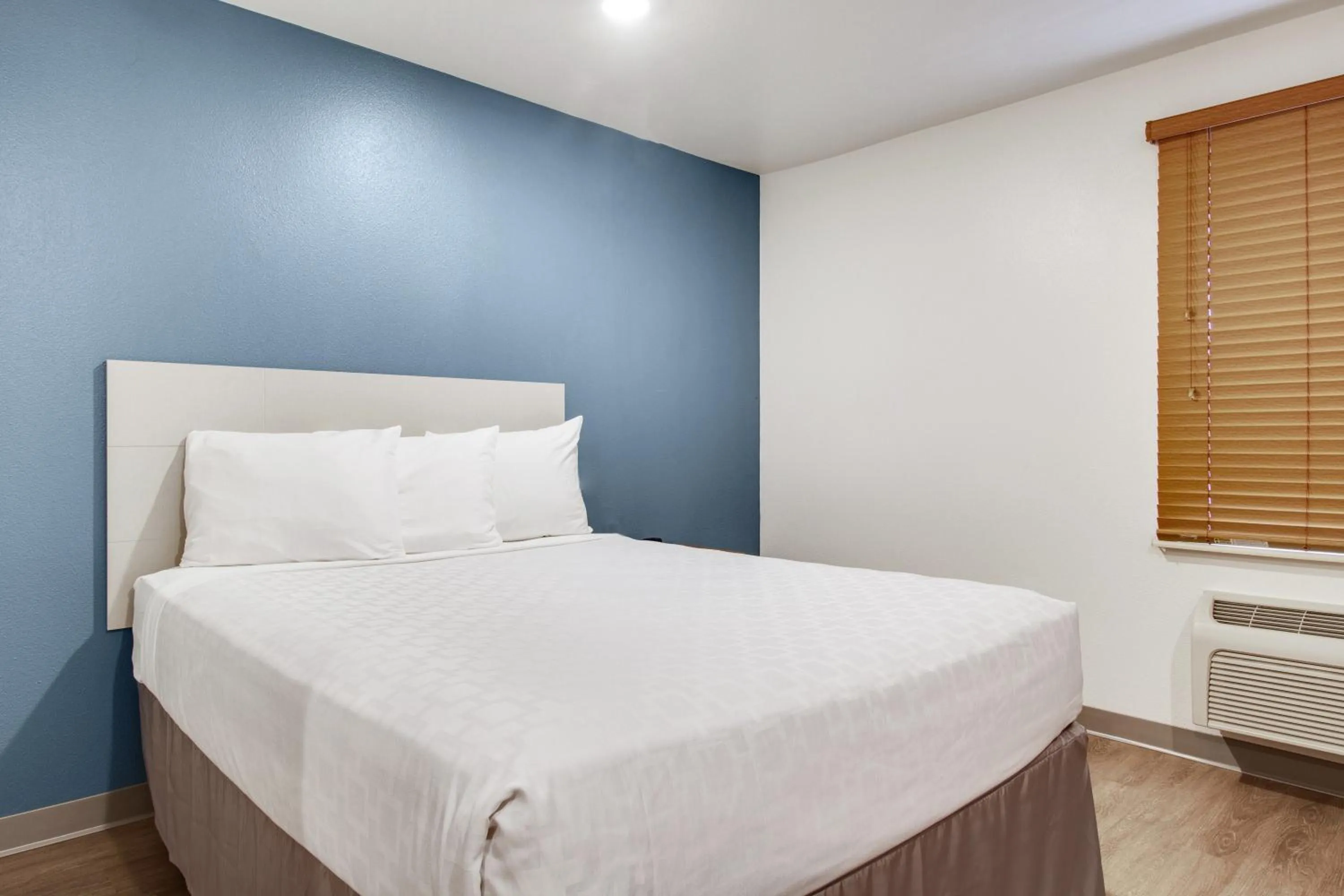 Bed in WoodSpring Suites Houston Willowbrook