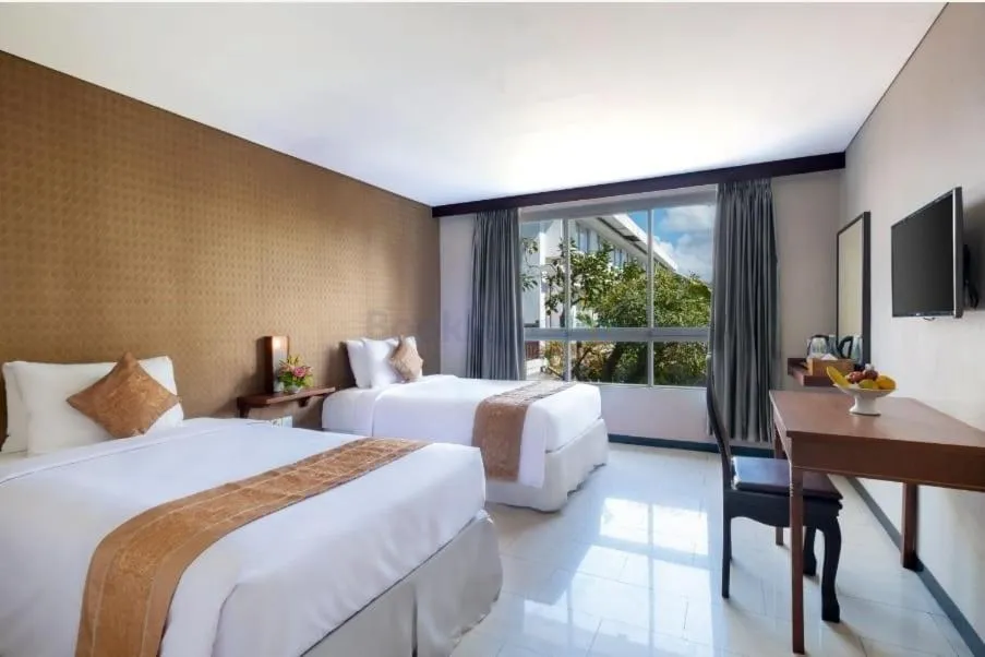 Bed in The Kanjeng Suites Kuta Galeria - Bali