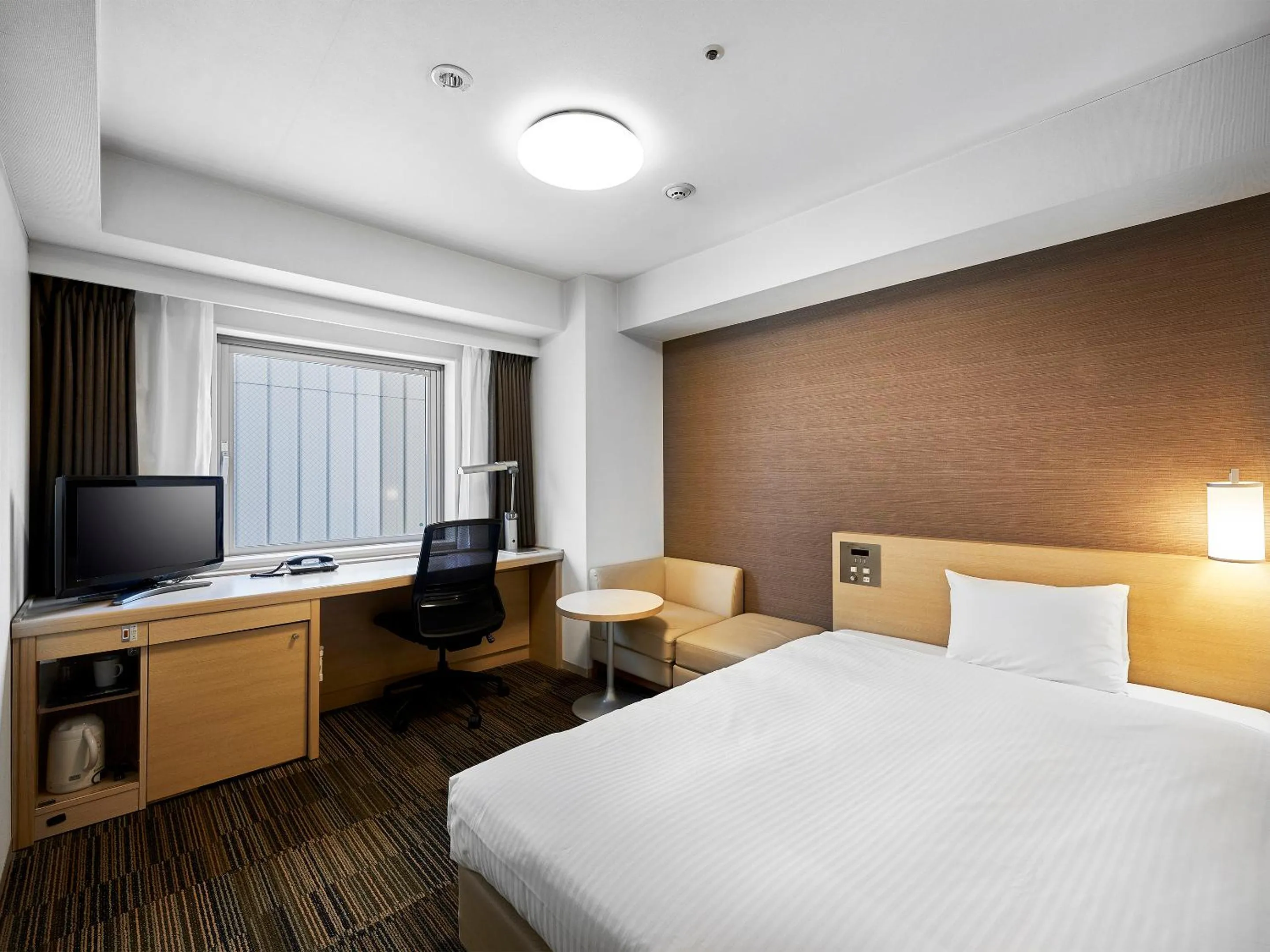 Bed in Daiwa Roynet Hotel Sendai