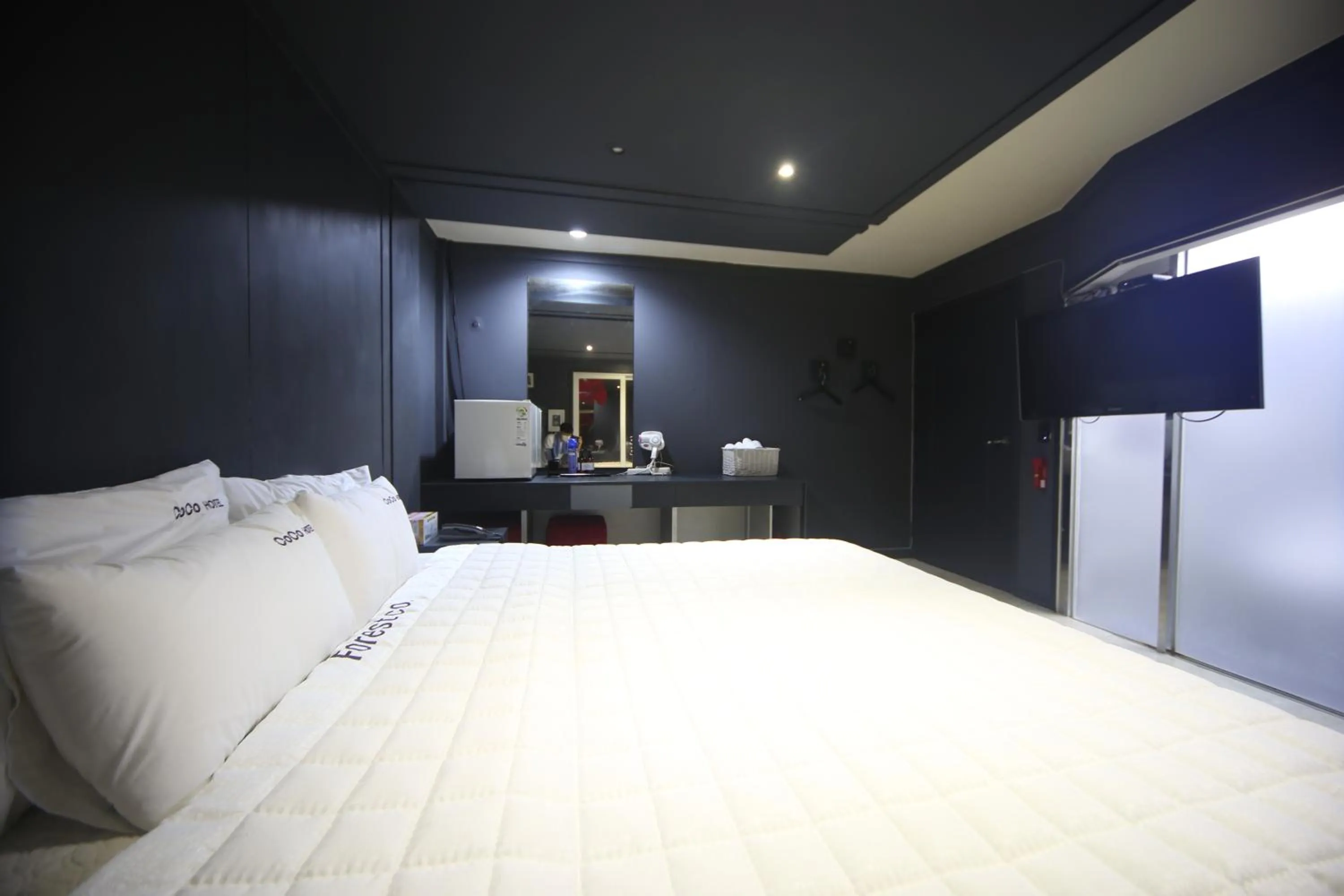 Bed in Songjeong Coco Hotel