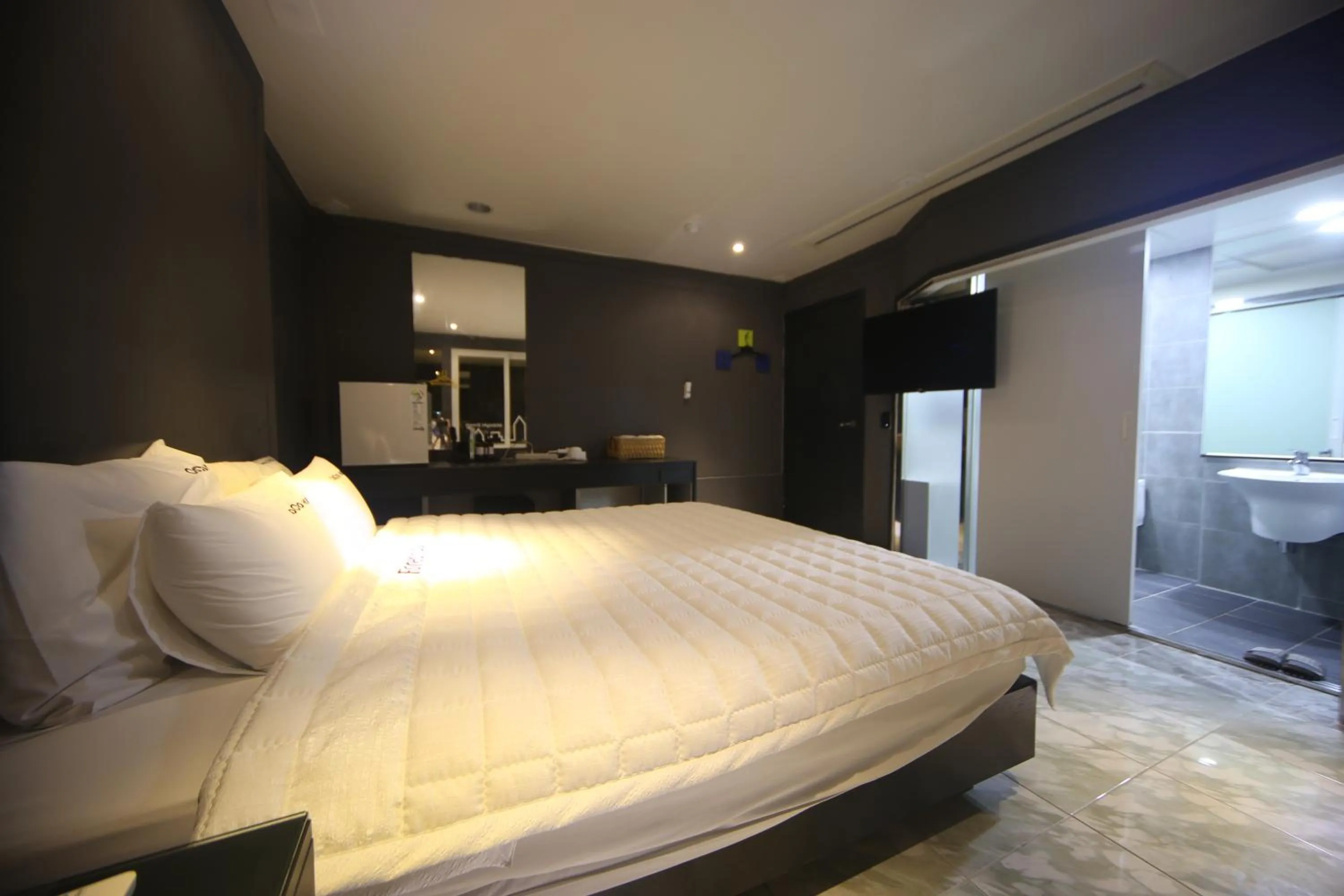 Bed in Songjeong Coco Hotel