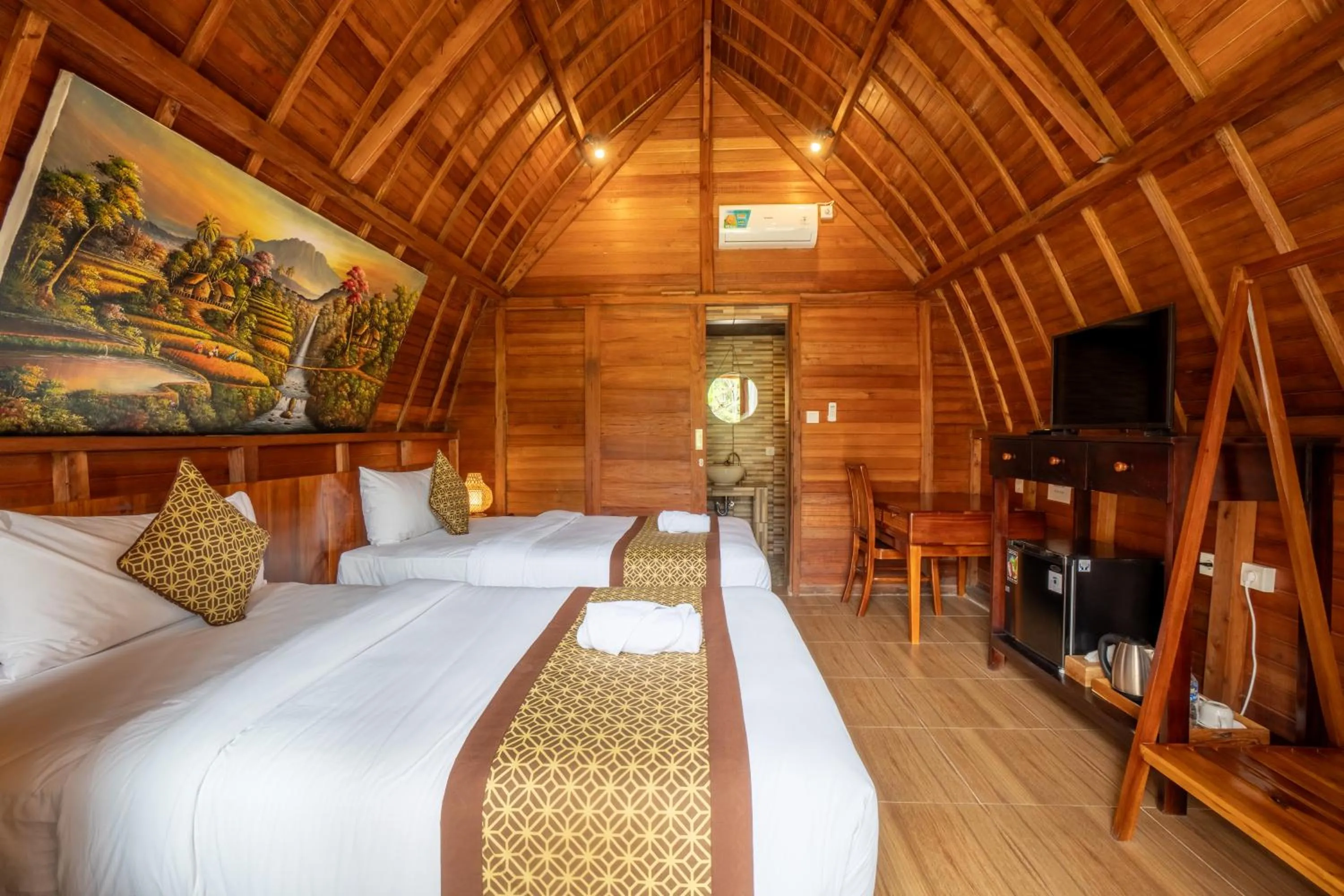 Communal lounge/ TV room, Bed in Puri Kurnia Ayu