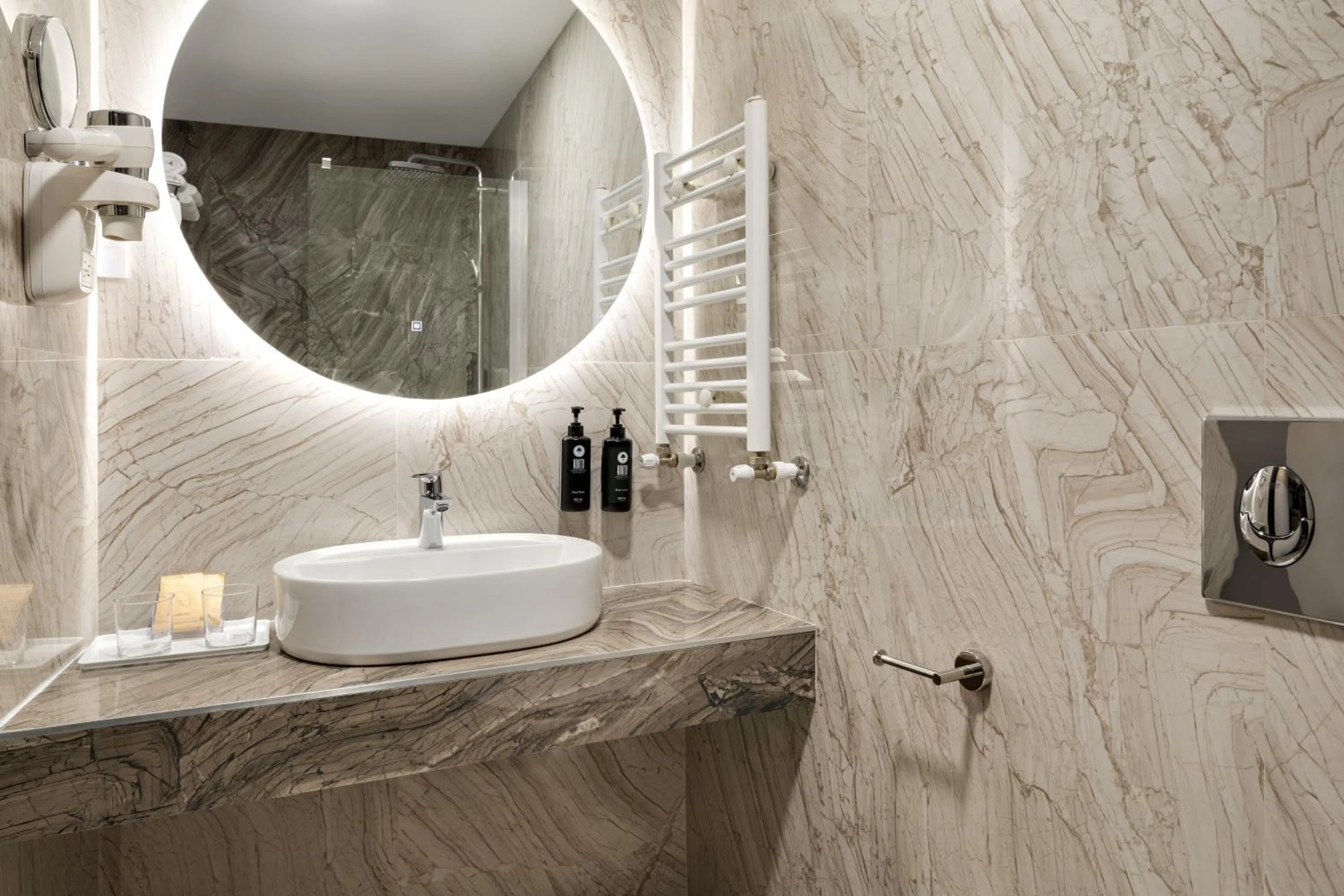 Bathroom in Ramada by Wyndham Bucharest Otopeni Airport