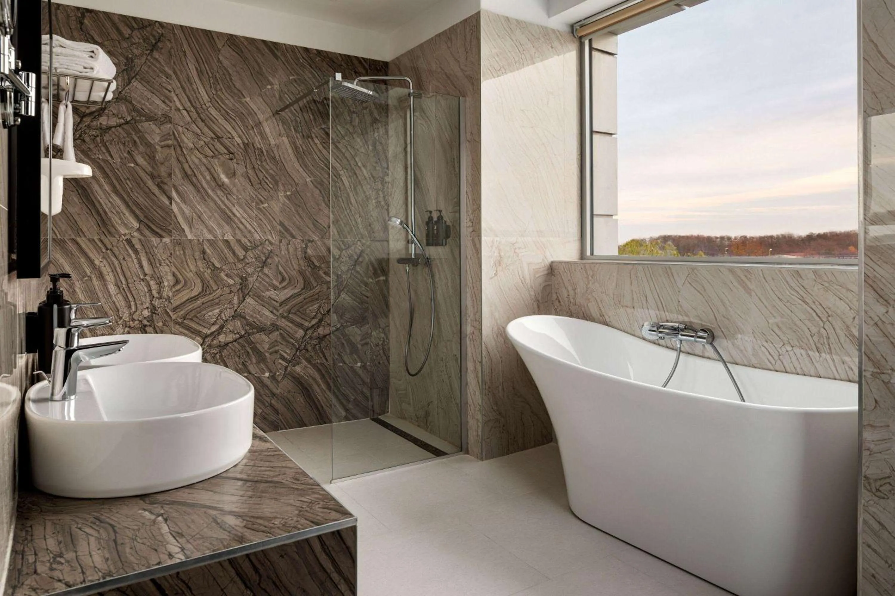 Bathroom in Ramada by Wyndham Bucharest Otopeni Airport