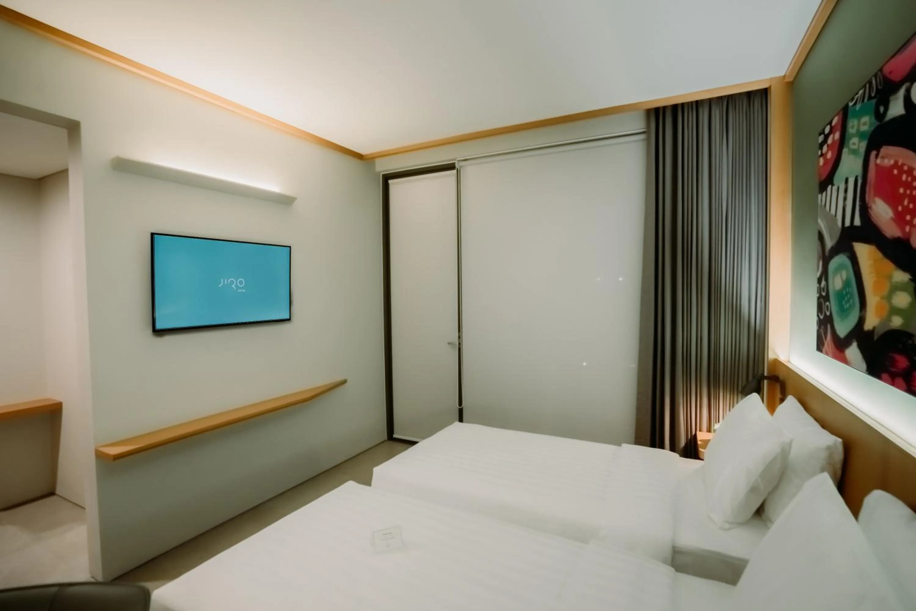 Bed in Jiro Hotel