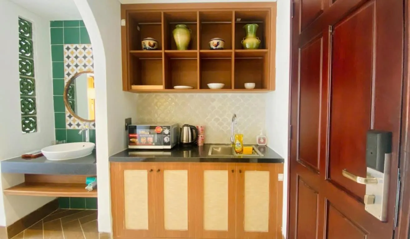 Kitchen or kitchenette, Bed in Sujet Hotel Da Nang