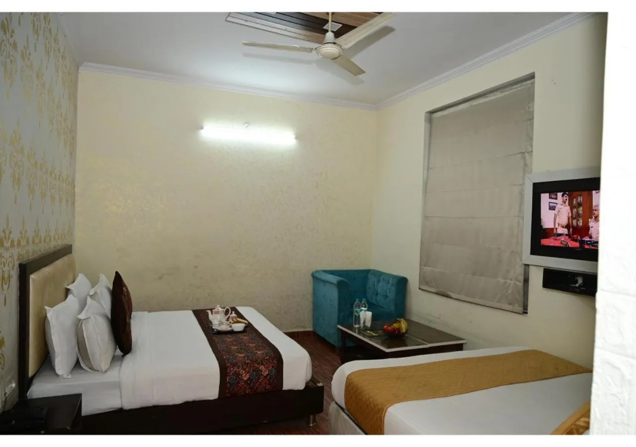 Bed in Hotel Krishna Pride