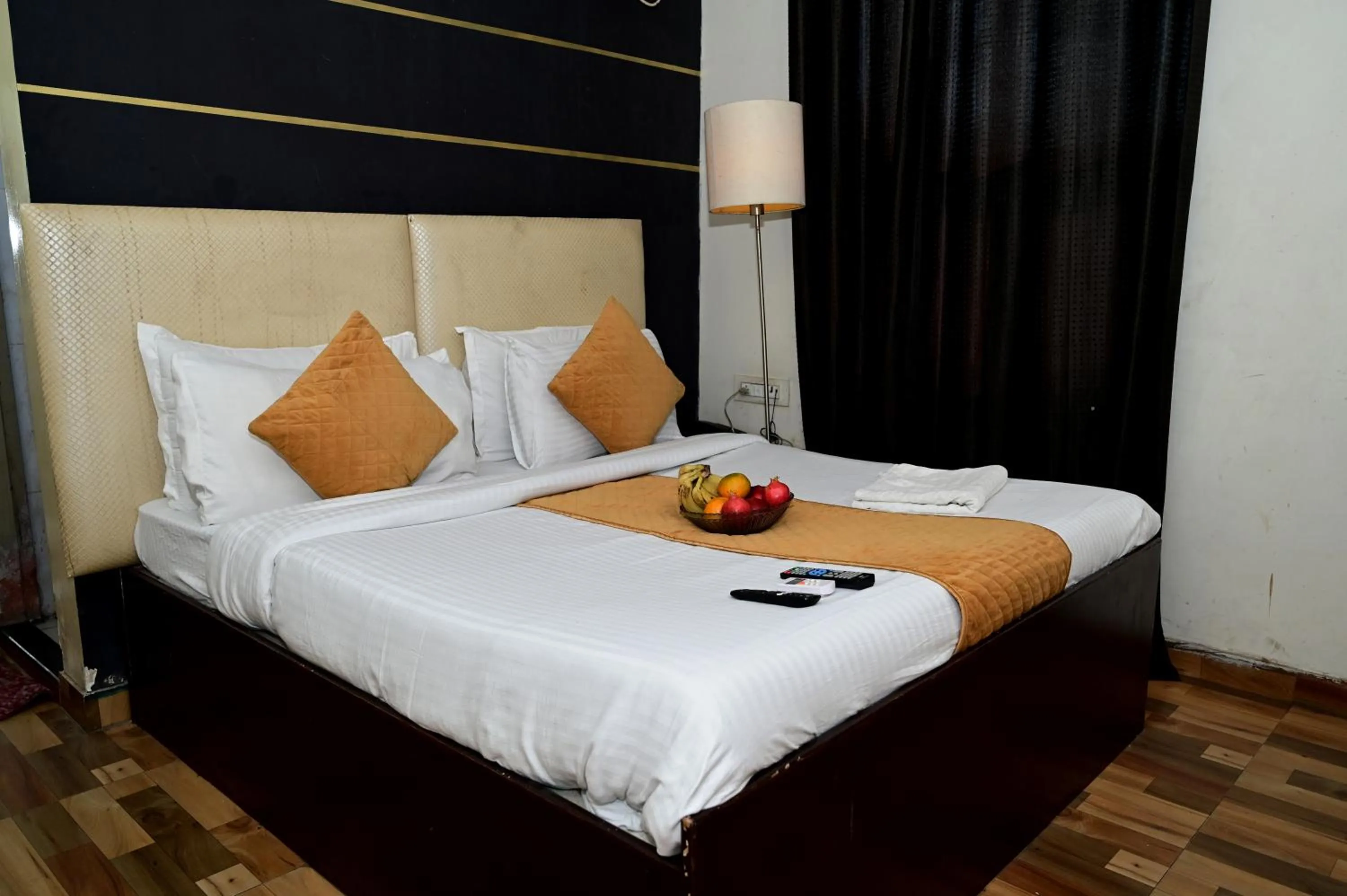 Bed in Hotel Krishna Pride
