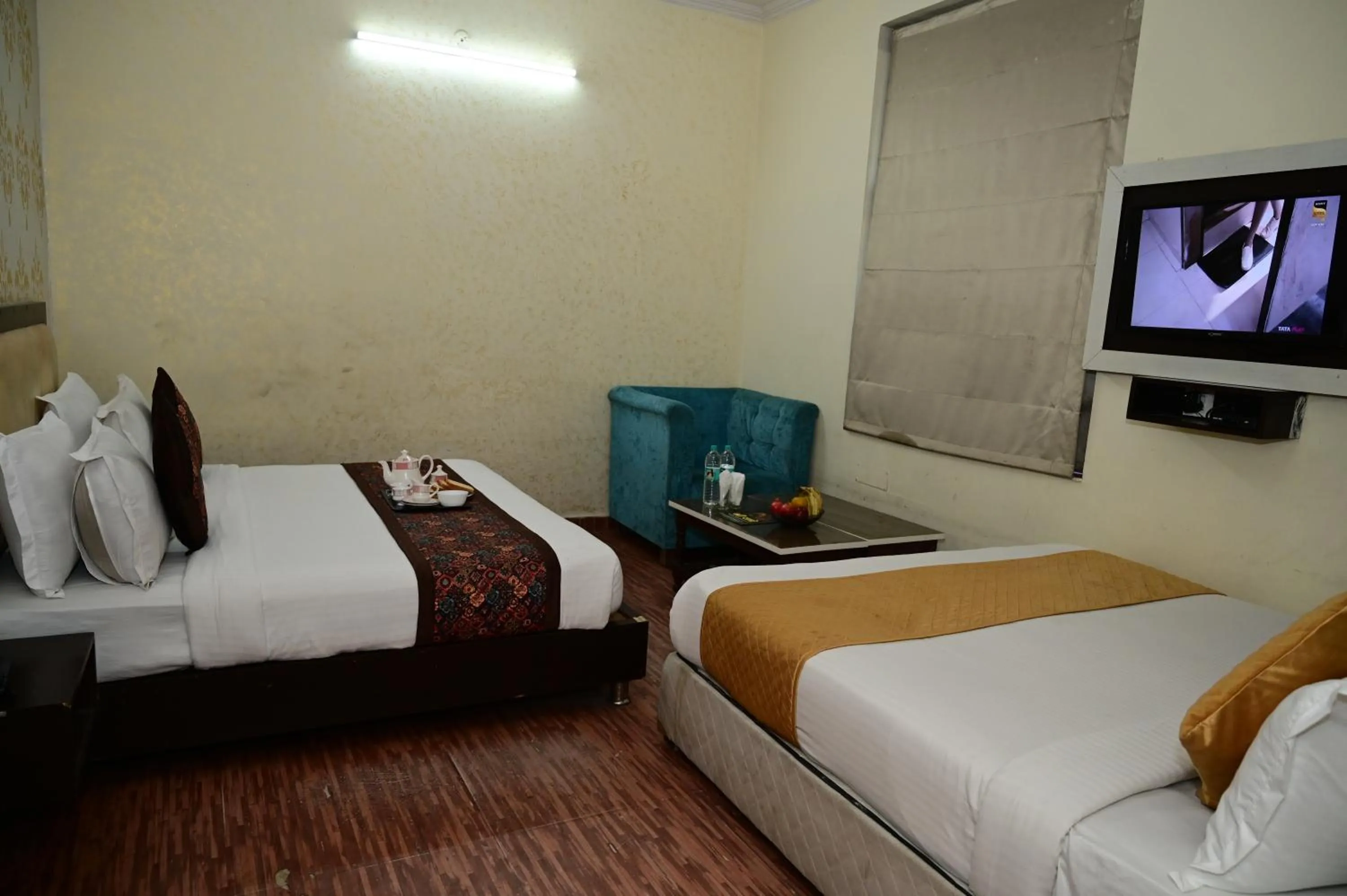 Bed in Hotel Krishna Pride