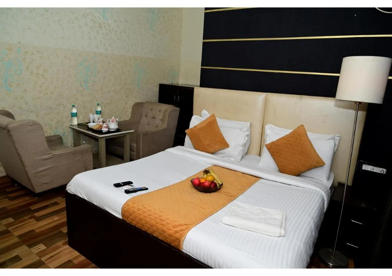 Bed in Hotel Krishna Pride