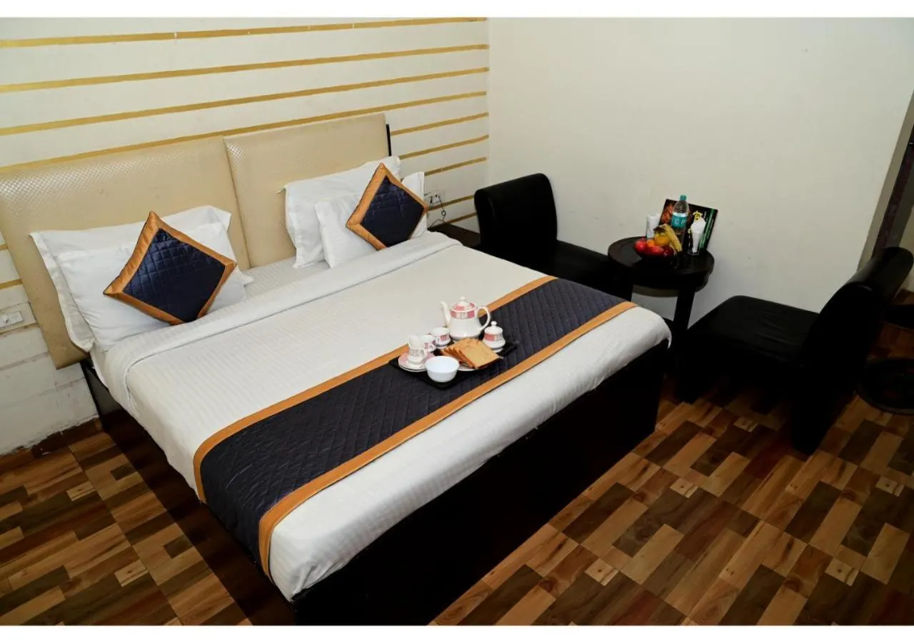 Bed in Hotel Krishna Pride