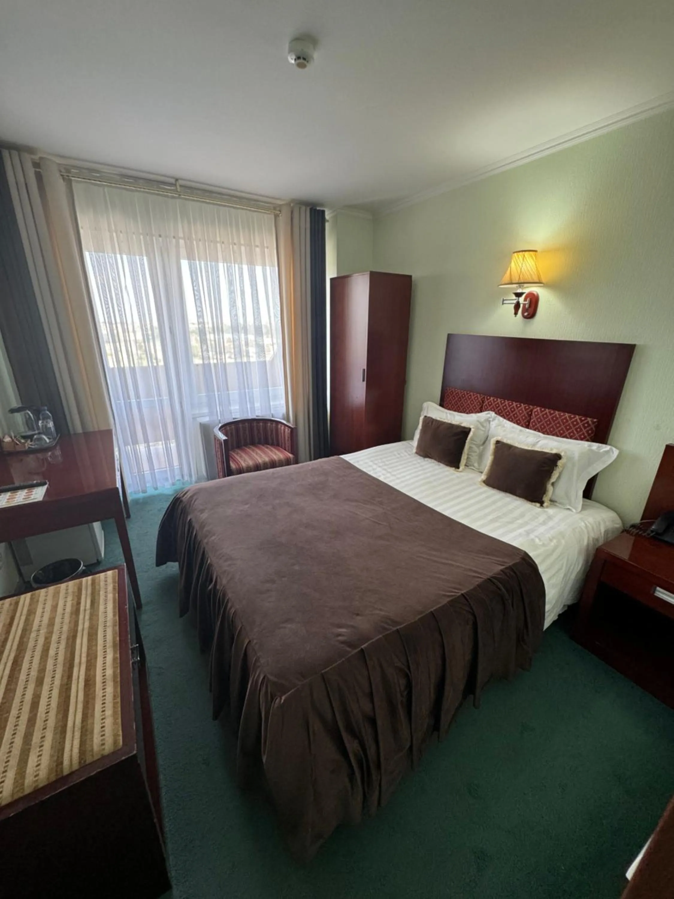 Bed in Hotel Grand Bukhara