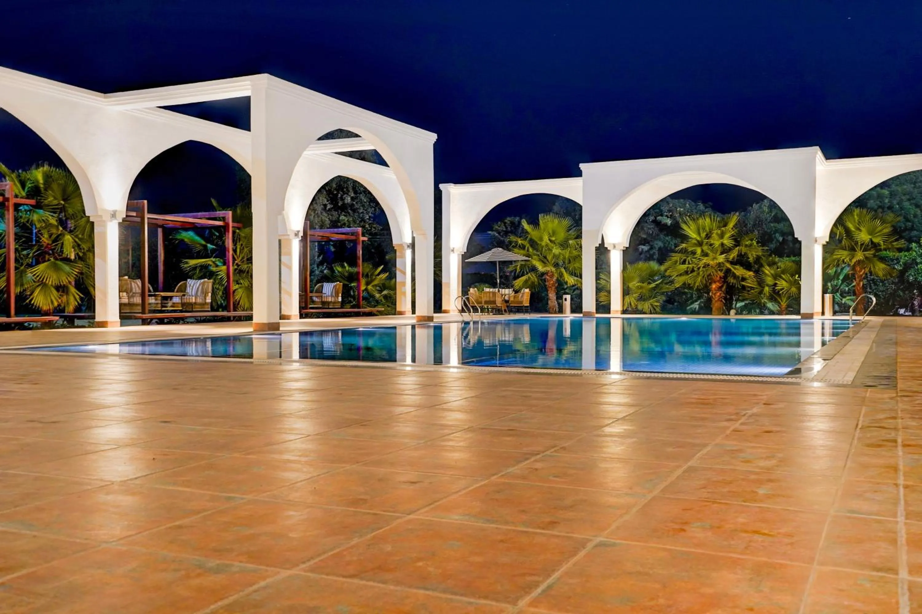 Swimming pool in Sunday Resort & Spa by CheckIn Manesar Gurugram