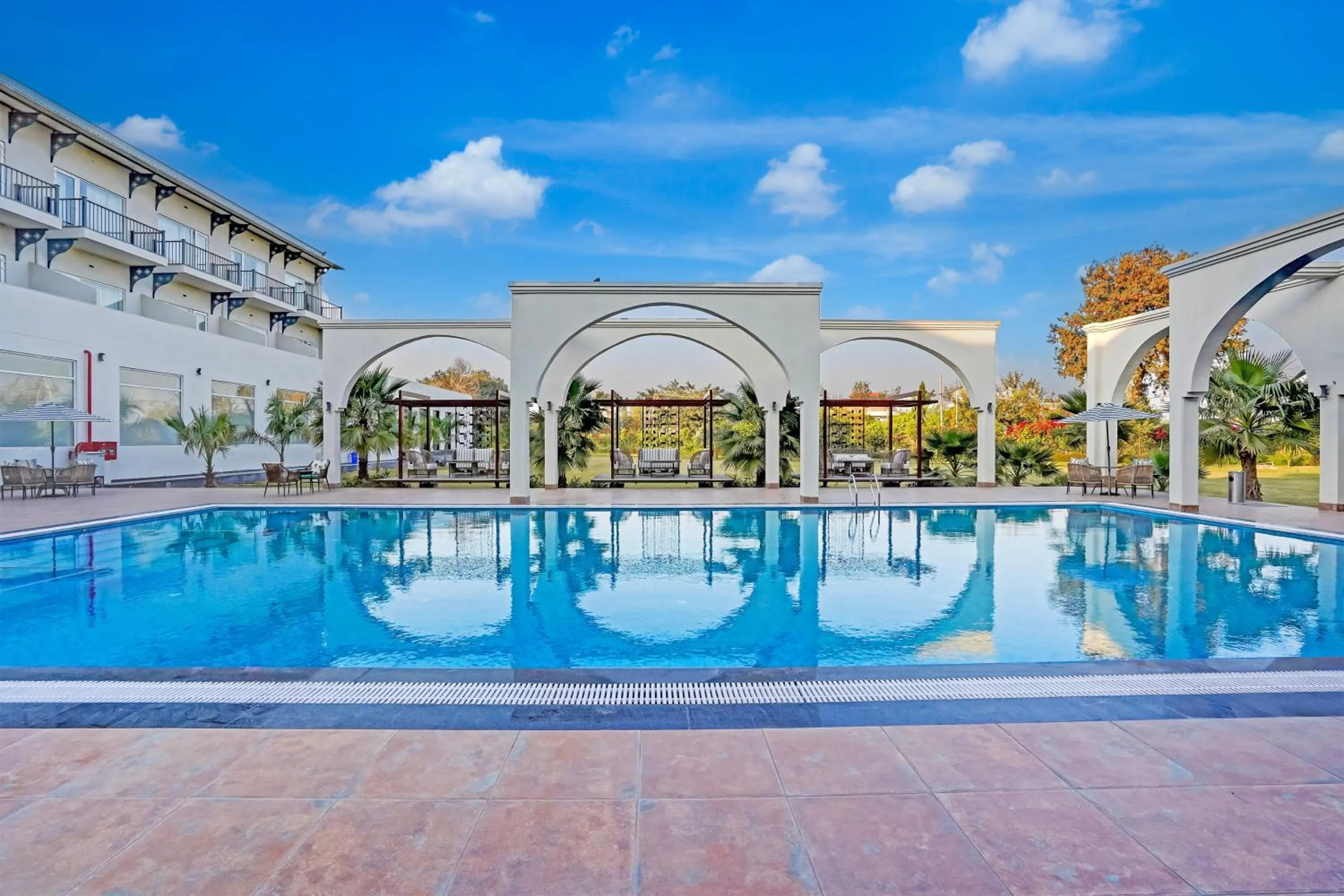 Swimming pool in Sunday Resort & Spa by CheckIn Manesar Gurugram