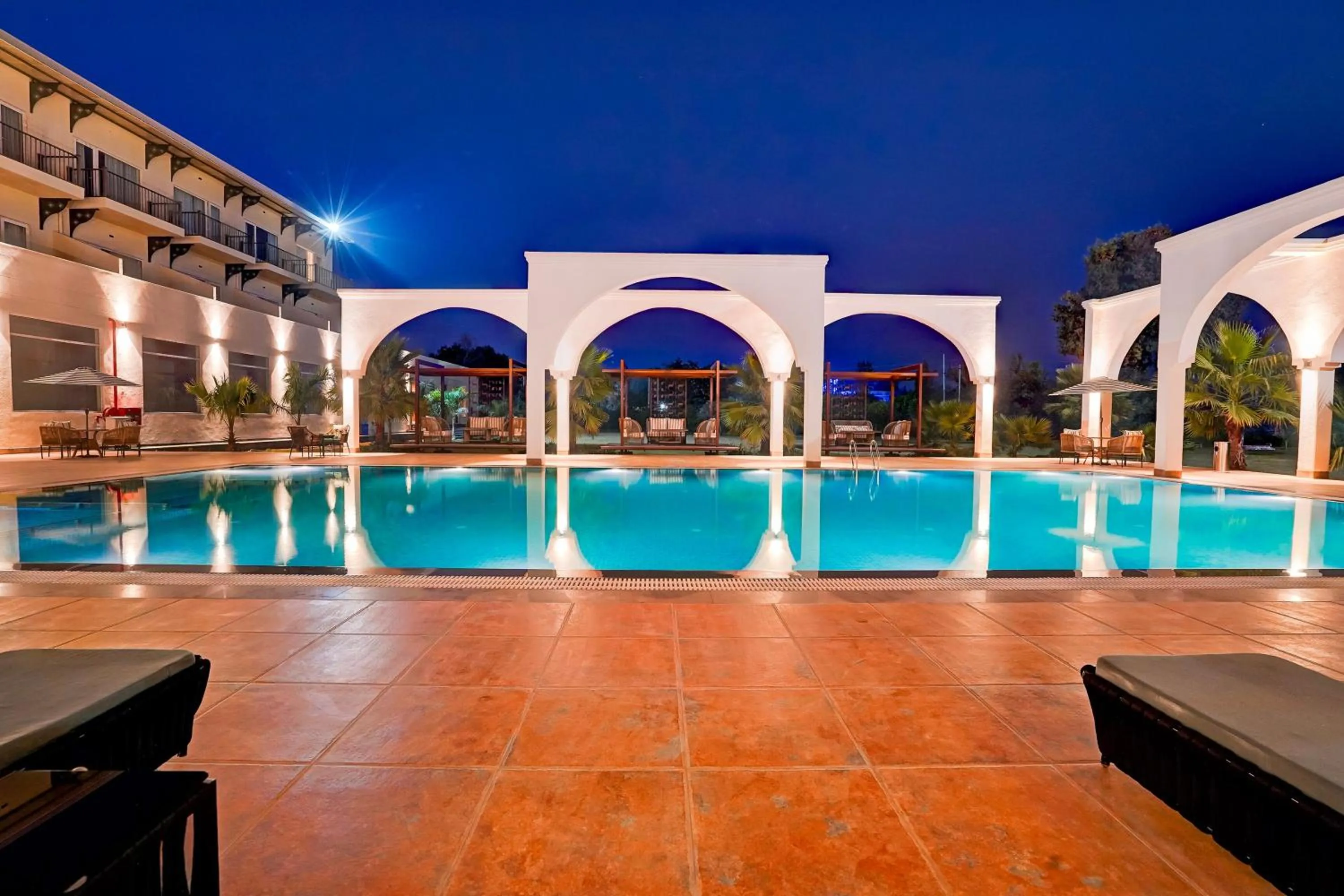 Swimming pool in Sunday Resort & Spa by CheckIn Manesar Gurugram