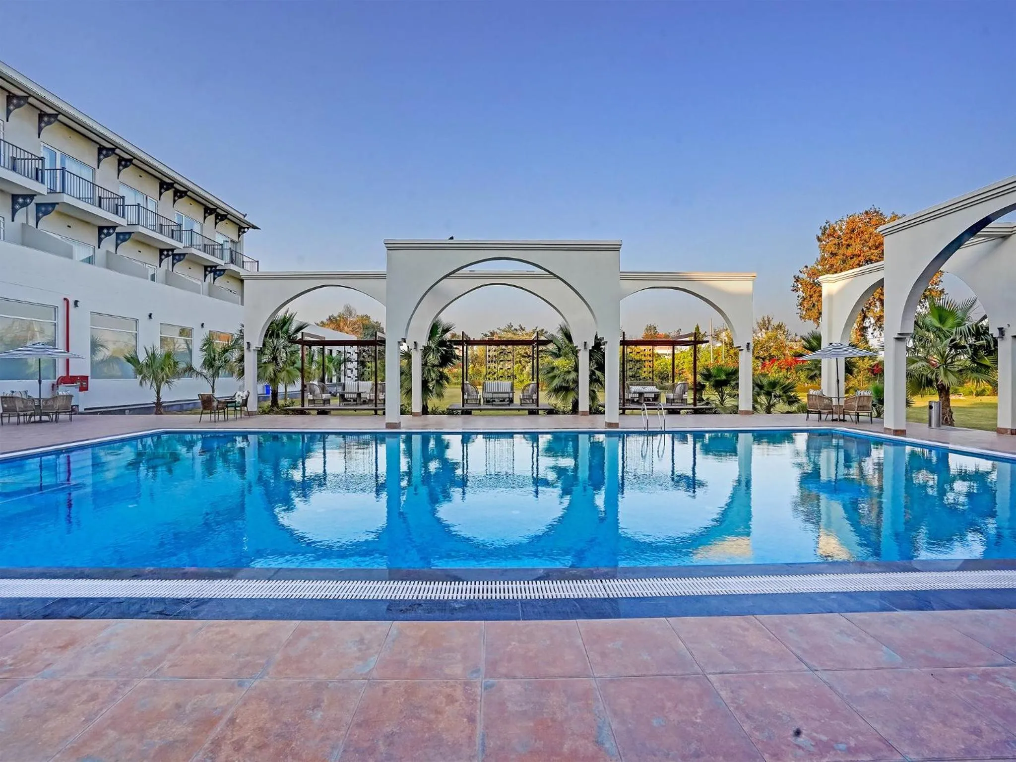 Swimming pool in Sunday Resort & Spa by CheckIn Manesar Gurugram