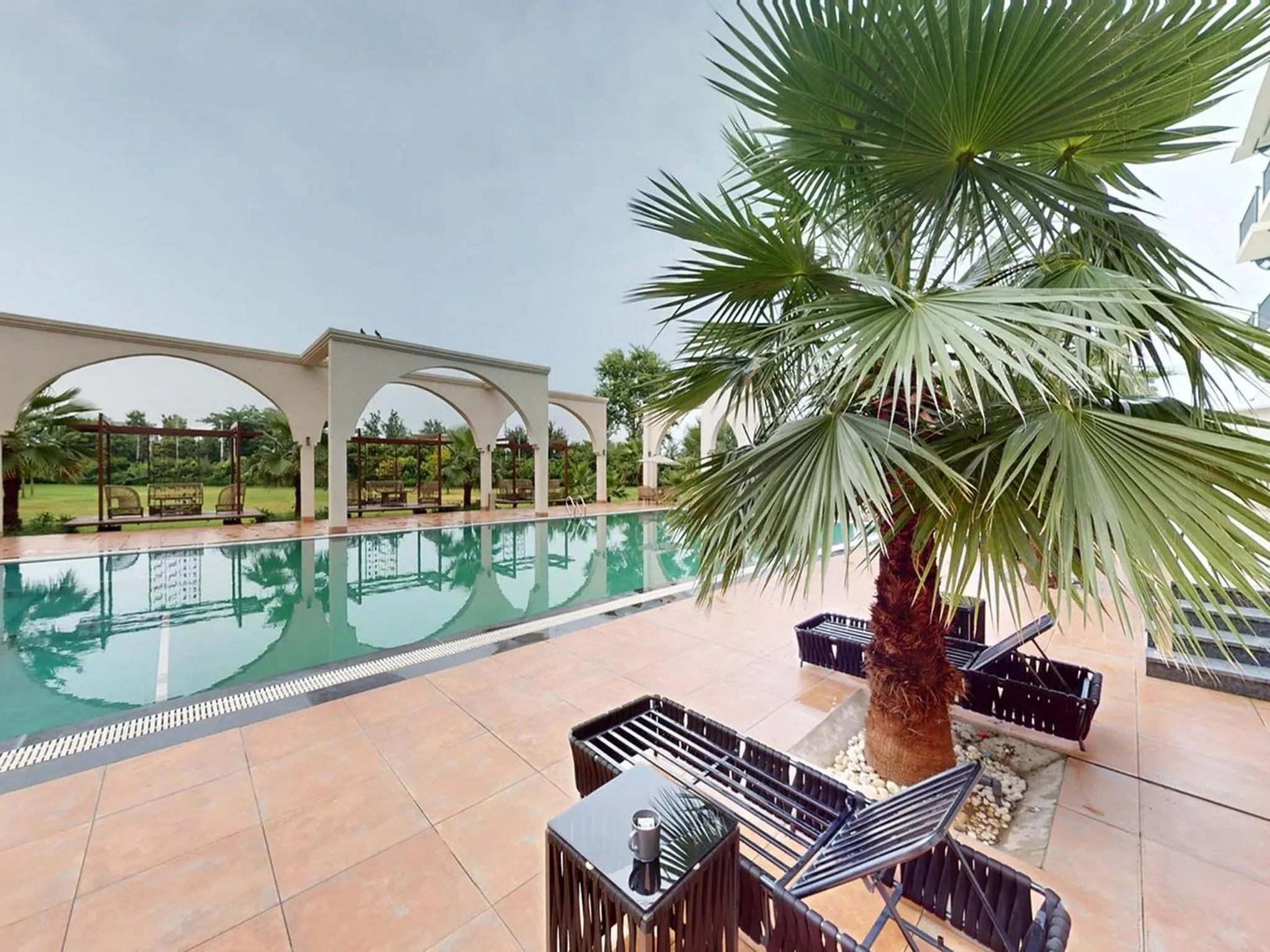 Swimming pool in Sunday Resort & Spa by CheckIn Manesar Gurugram