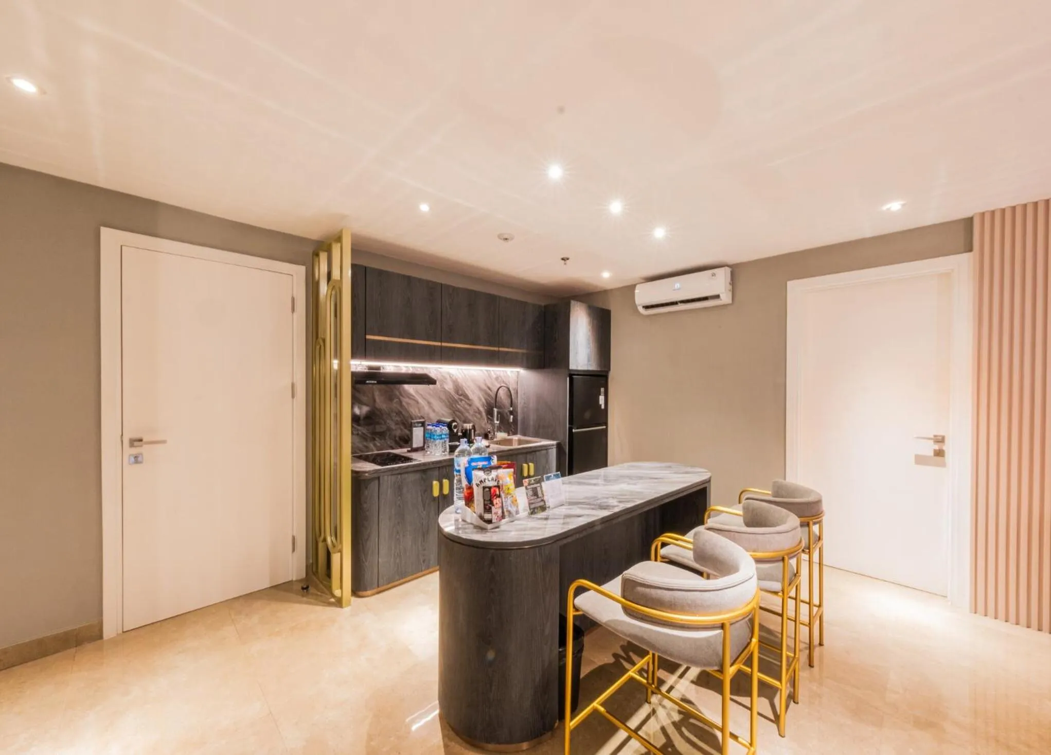 Kitchen or kitchenette in The All - Suite Pentacity Hotel Balikpapan