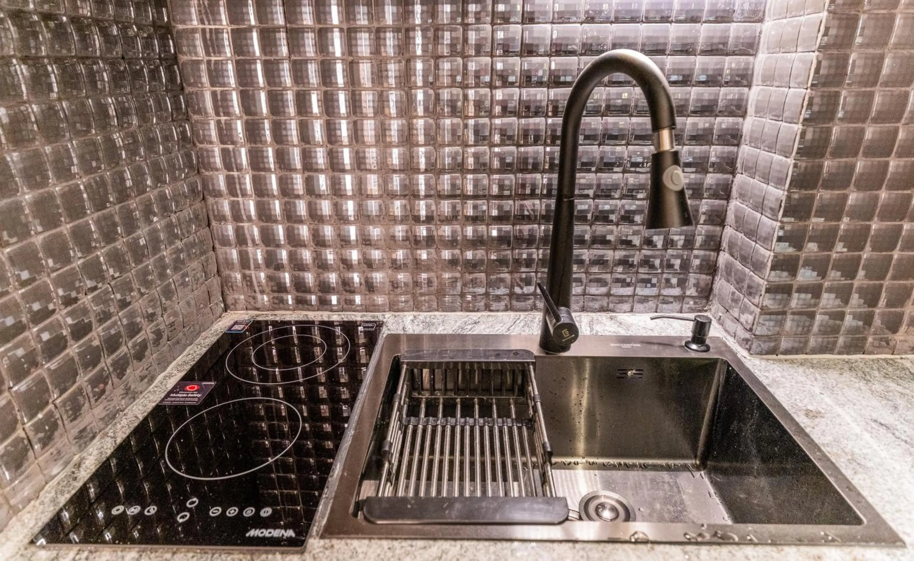 Kitchen or kitchenette in The All - Suite Pentacity Hotel Balikpapan