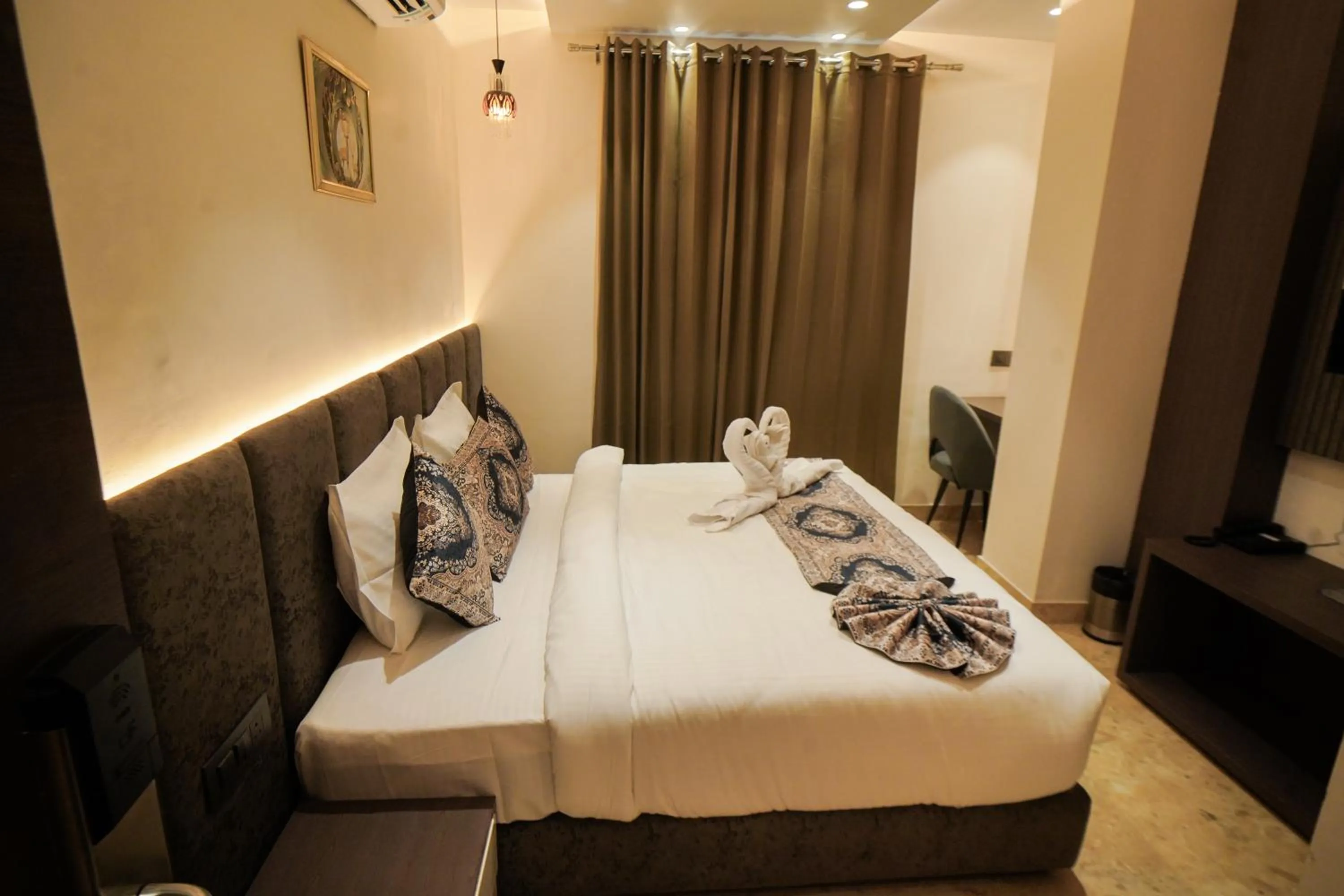 Bed in Hotel Ammison Inn & Suites