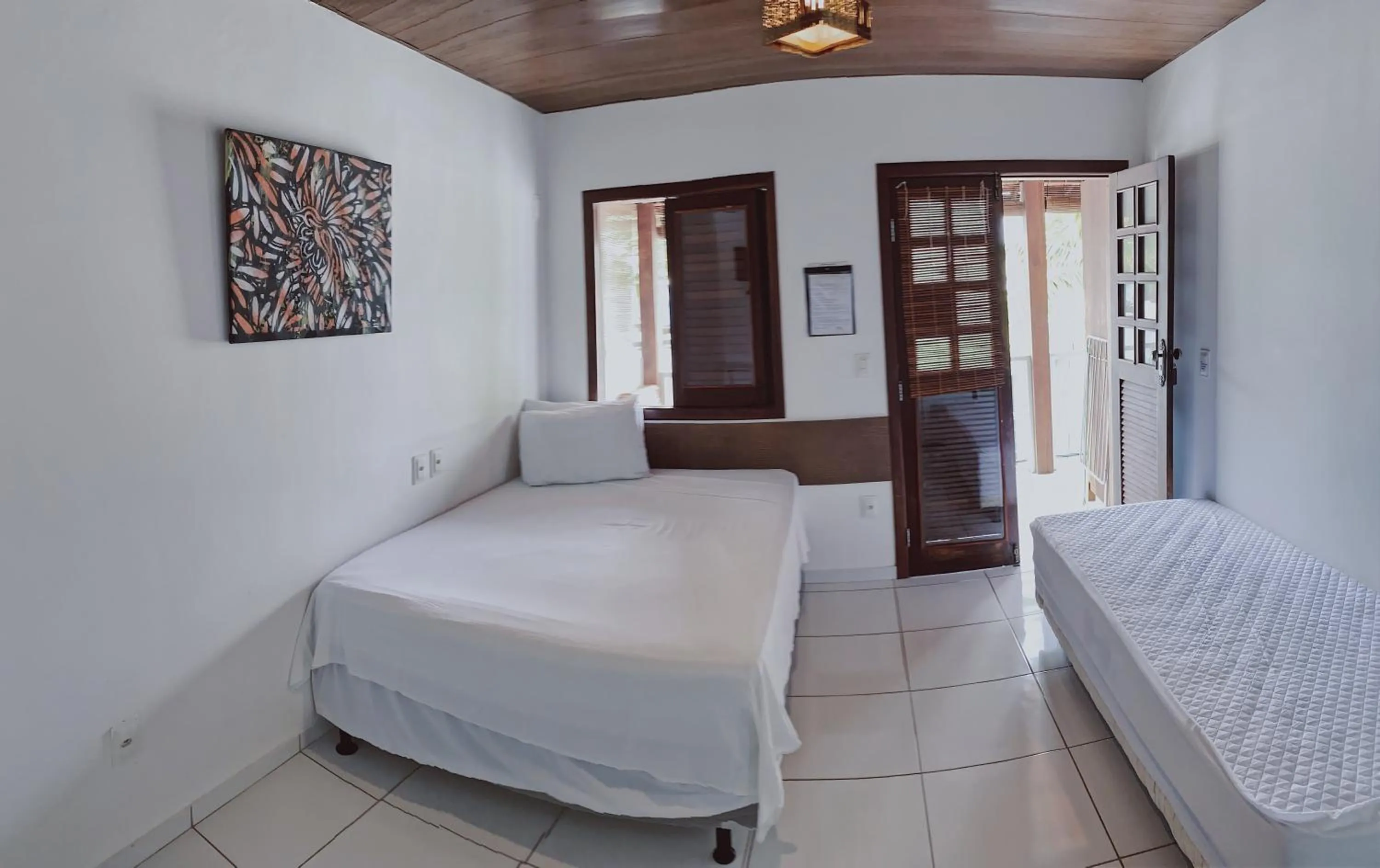 Bed in Pousada Brasil Caribe