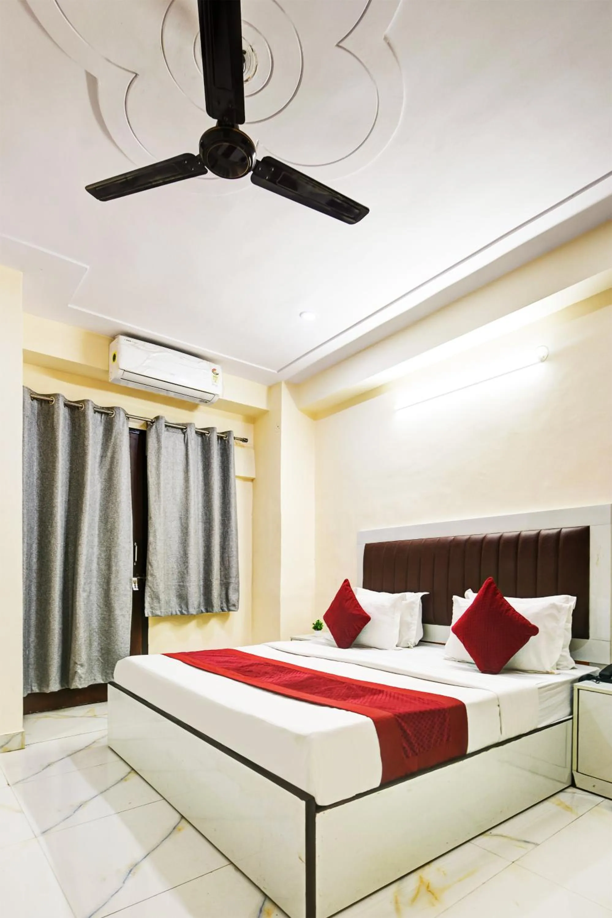 Bed in Hotel Krishna Tower