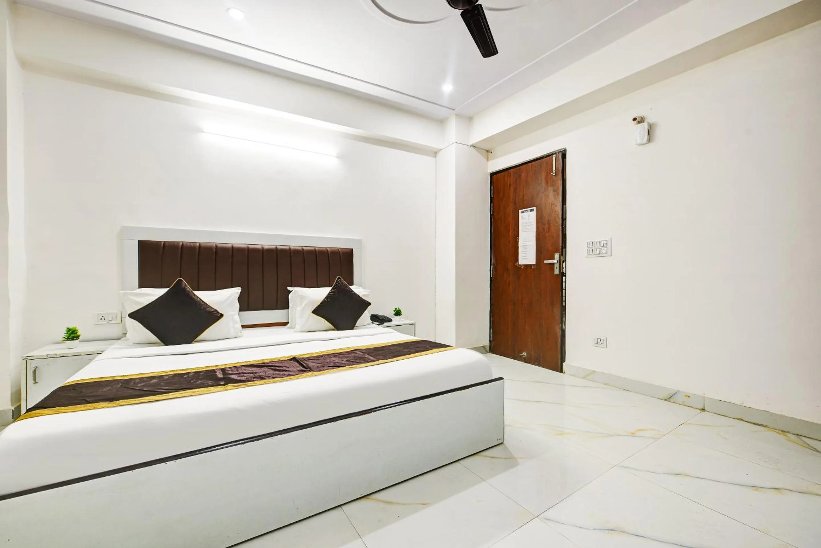Bed in Hotel Krishna Tower
