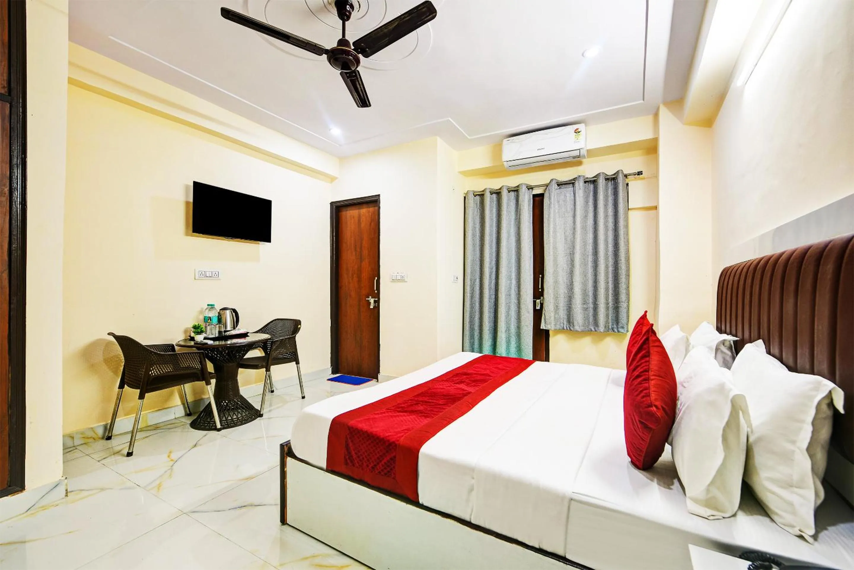 Bed in Hotel Krishna Tower