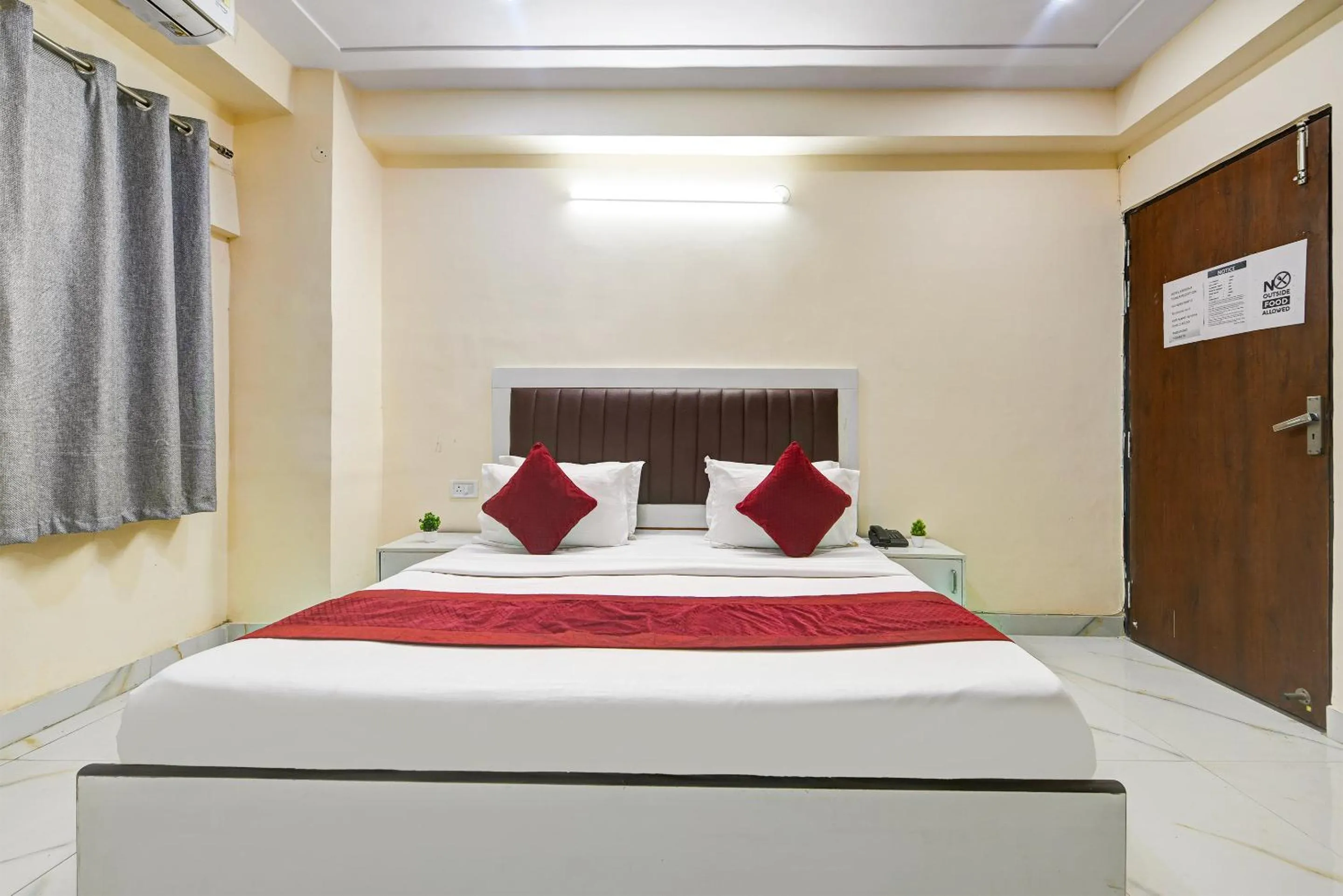 Bed in Hotel Krishna Tower